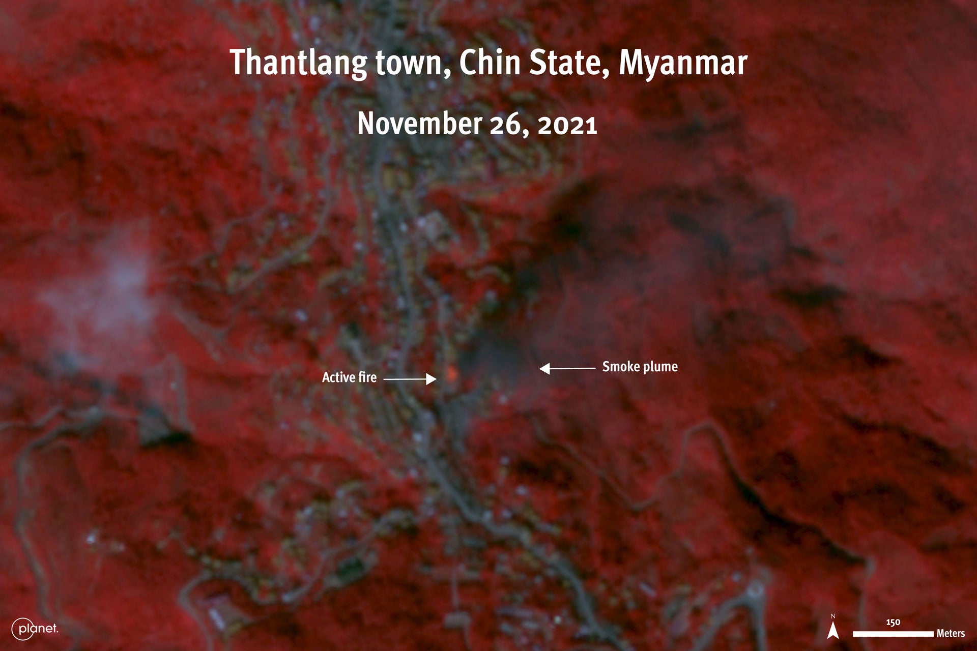 Satellite image displayed in color infrared shows an active fire