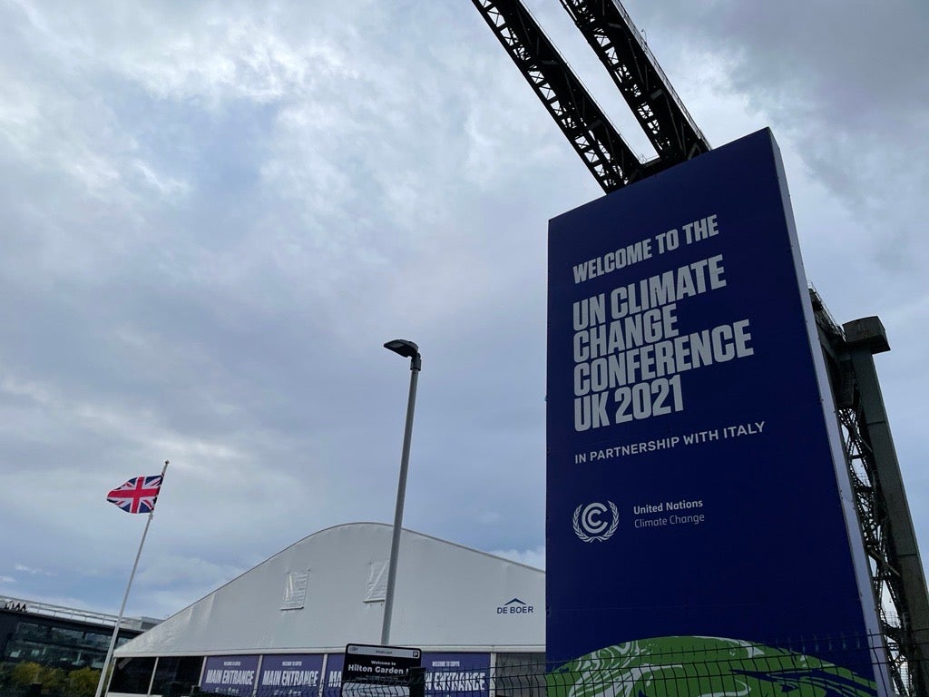 Exterior of the COP26 Climate conference, showing the event banner.