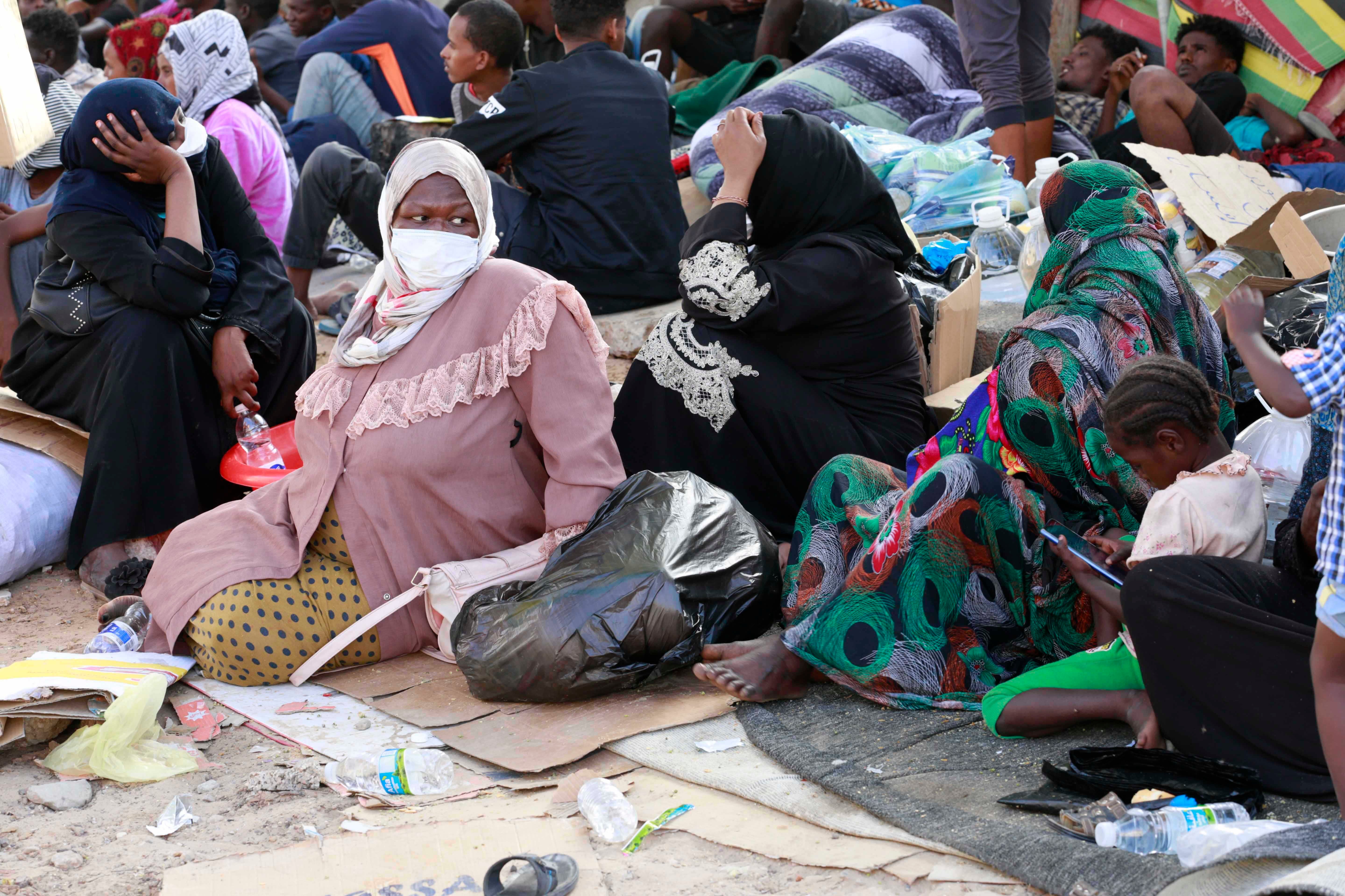 Asylum seekers and refugees camped in front of a shuttered facility managed by the United Nations High Commission for Refugees (UNHCR)  in Tripoli,