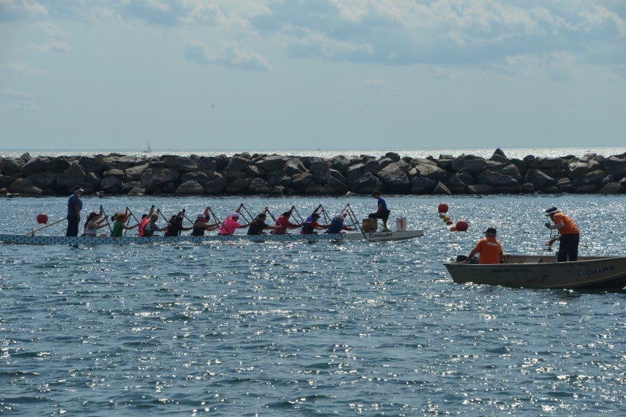 Kaola Baird racing with teammates at the Dragon Boat Race Festival