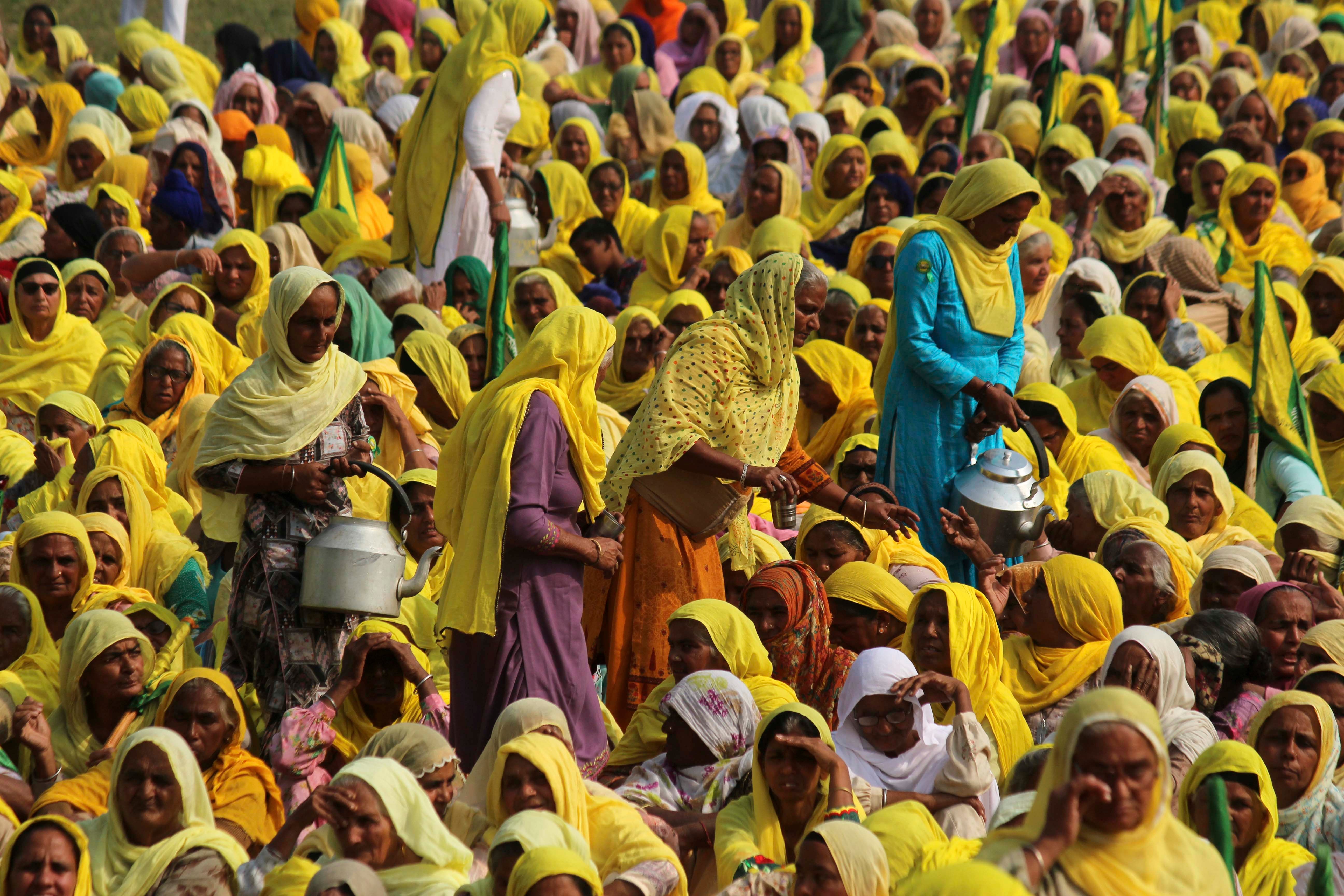 Women farmers attend a gathering to mark the first anniversary of their protests against controversial farm reforms at Haryana's Bahadurgarh, on the outskirts of New Delhi, India, November 26, 2021.