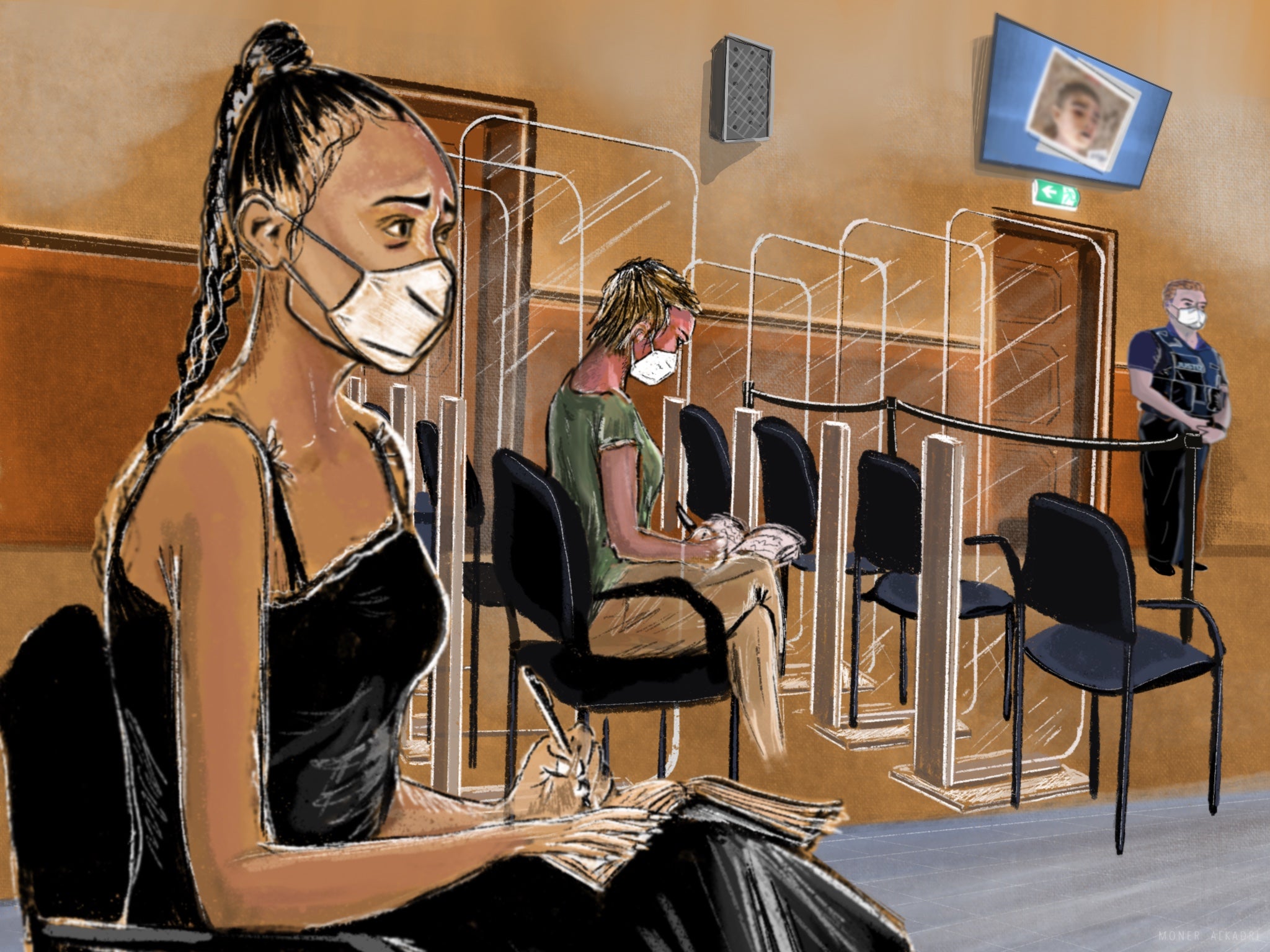 Women wearing facemasks sit in a courtroom