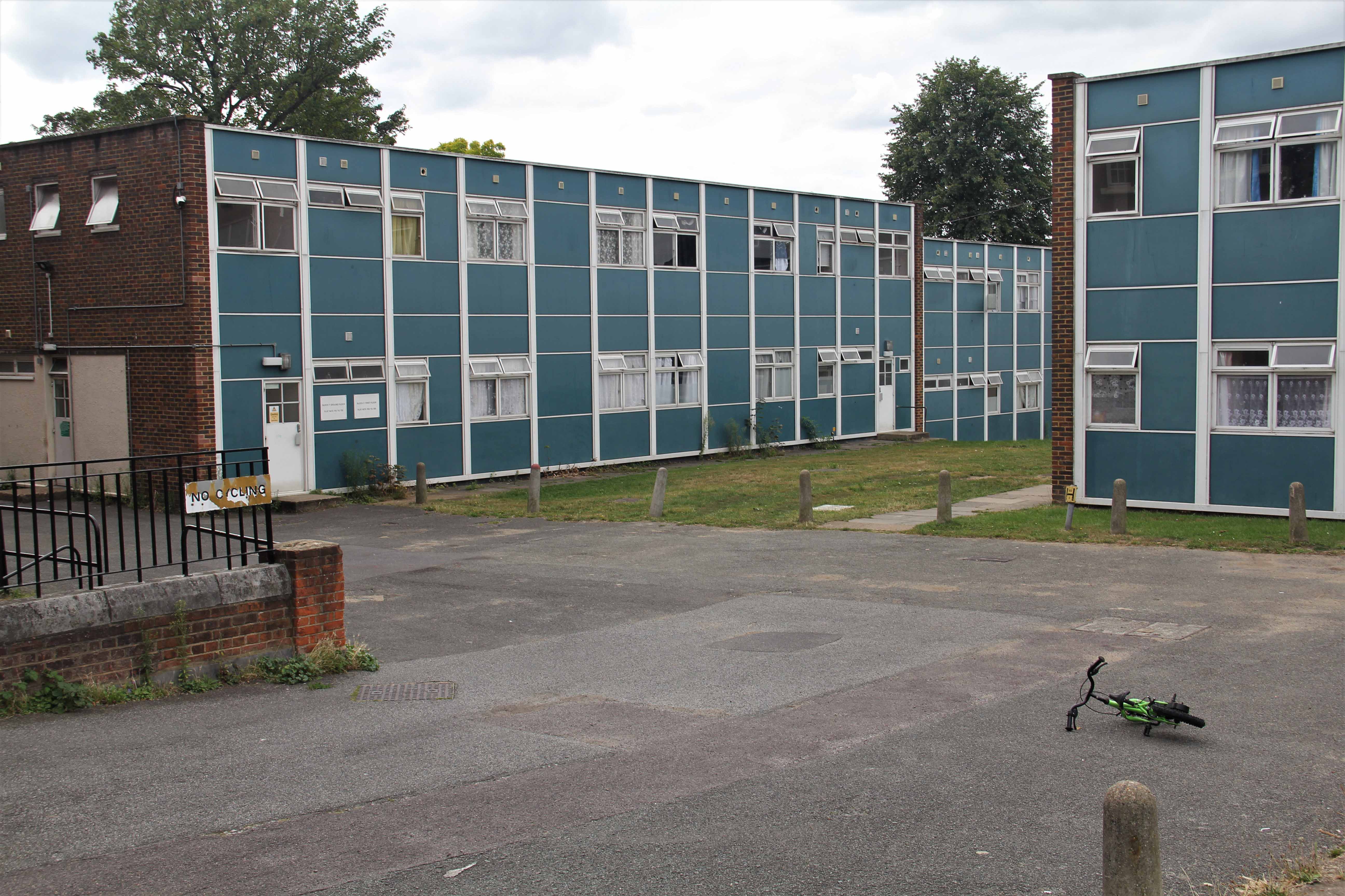 Courtyard of a blue and brick housing block