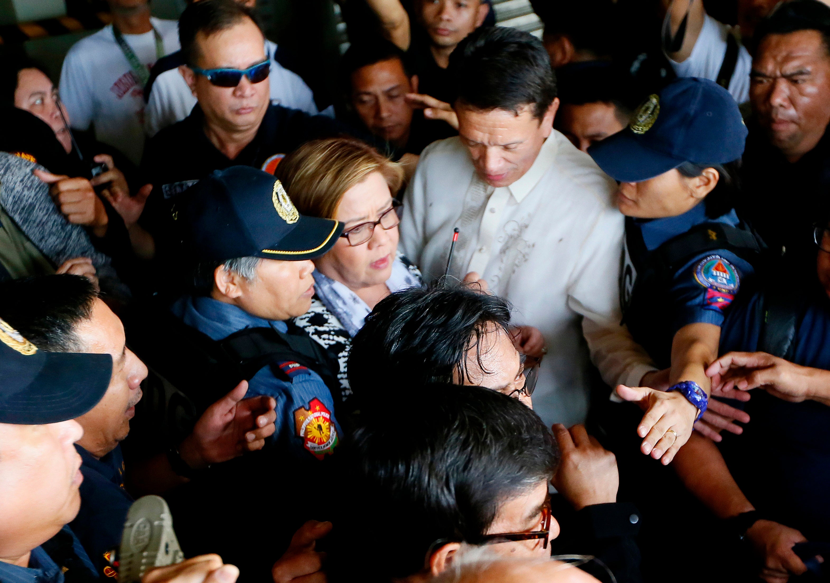 Senator Leila de Lima, center, is escorted to detention a day after a warrant was issued for her arrest, Manila, Philippines, February 24, 2017. 