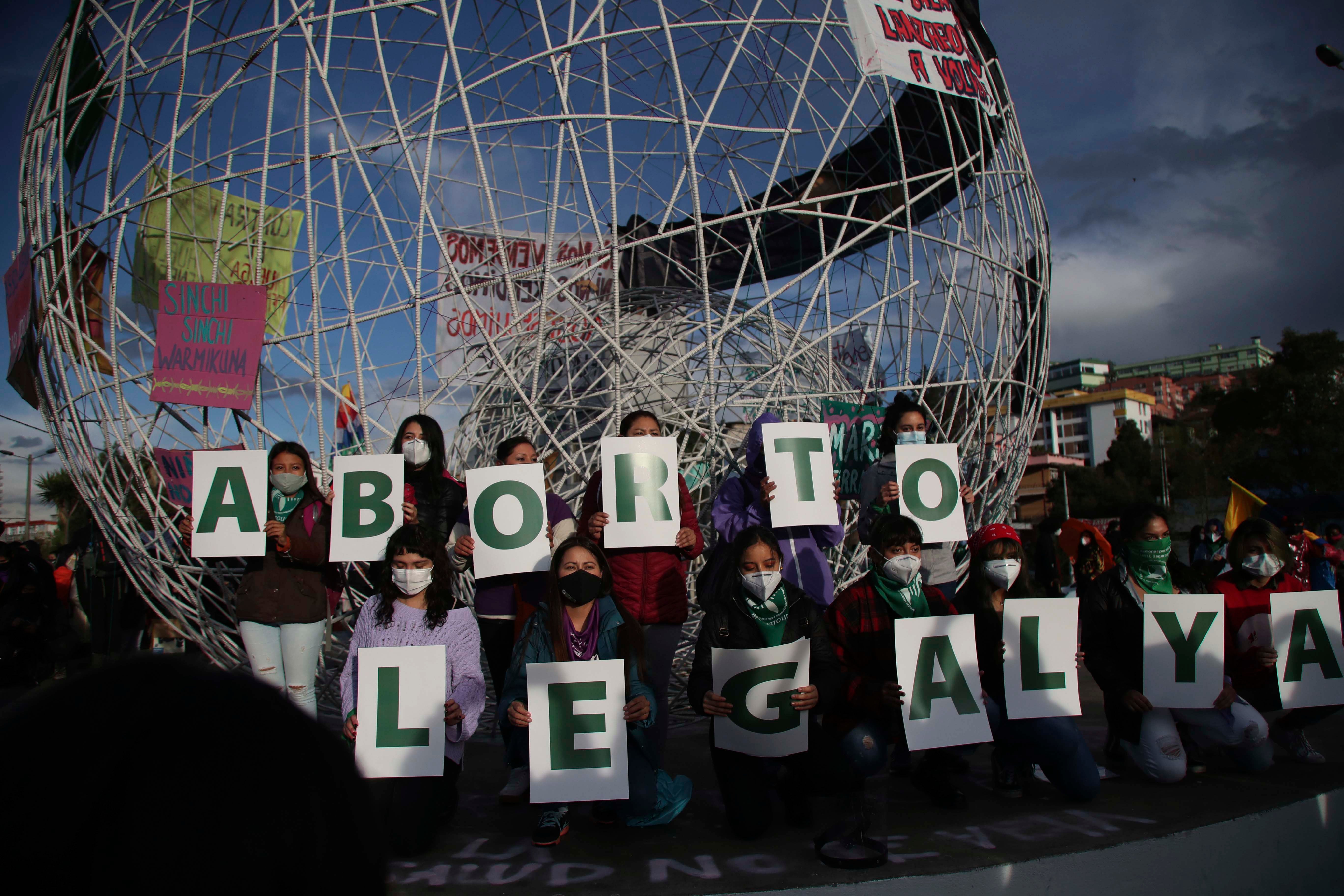 Women hold letters forming the phrase "Legal Abortion Now" during an abortion rights protest in Quito, Ecuador, Monday, September 28, 2020. 