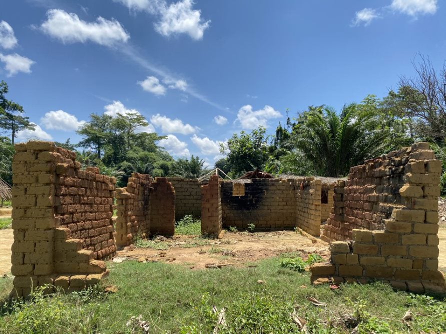 A house burned and destroyed by Nkundo assailants during the February 2021 attack on the Indigenous village of Sambwakoy, Tshuapa province, Democratic Republic of Congo, October 2021. 