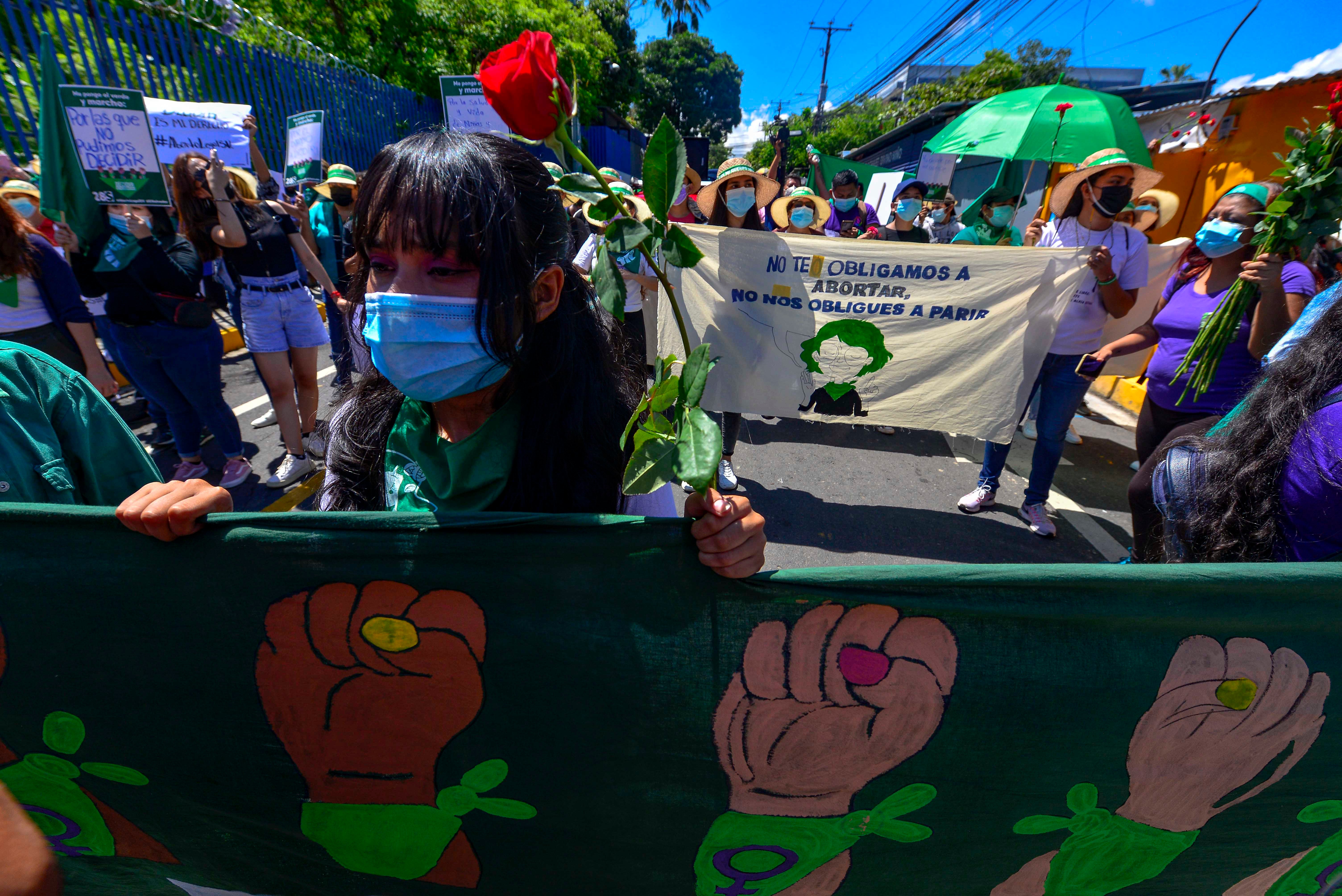 Women holding up banners