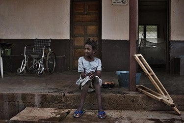 Hamamatou, a 13-year-old girl who had polio, in front of a Catholic mission where she lived in 2015. 