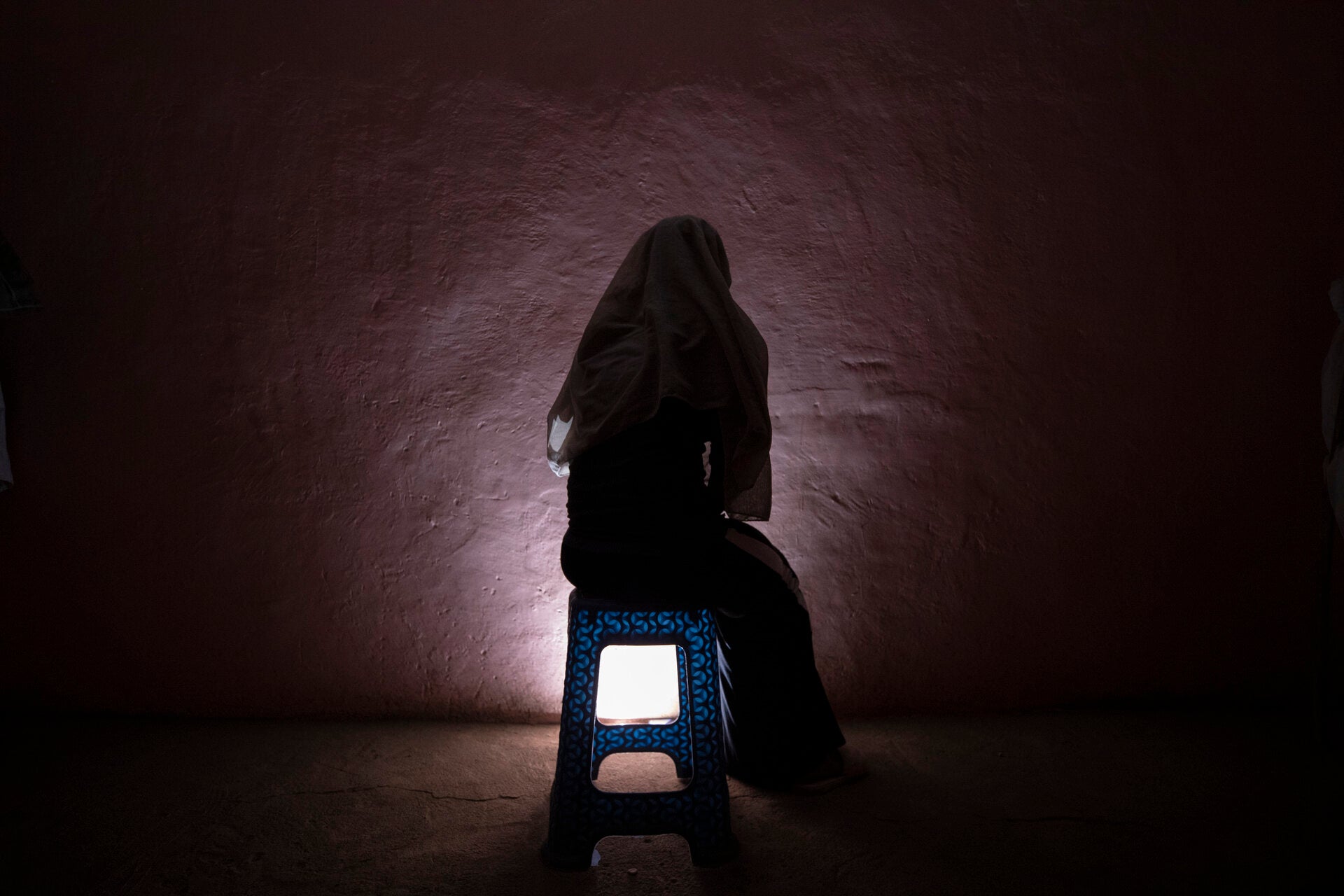 A Tigrayan refugee survivor of rape who fled the conflict in Ethiopia's Tigray sits for a portrait in eastern Sudan near the Sudan-Ethiopia border, on March 20, 2021.