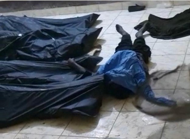 لقطة من فيديو بتاريخ 27 يناير/كانون الثاني 2022 تُظهر جثثًا في مشرحة مستشفى أبيشي الإقليمي، حيث نُقل بعد الهجمات العديد ممن قُتلوا على أيدي قوات الأمن في 25 يناير/كانون الثاني 