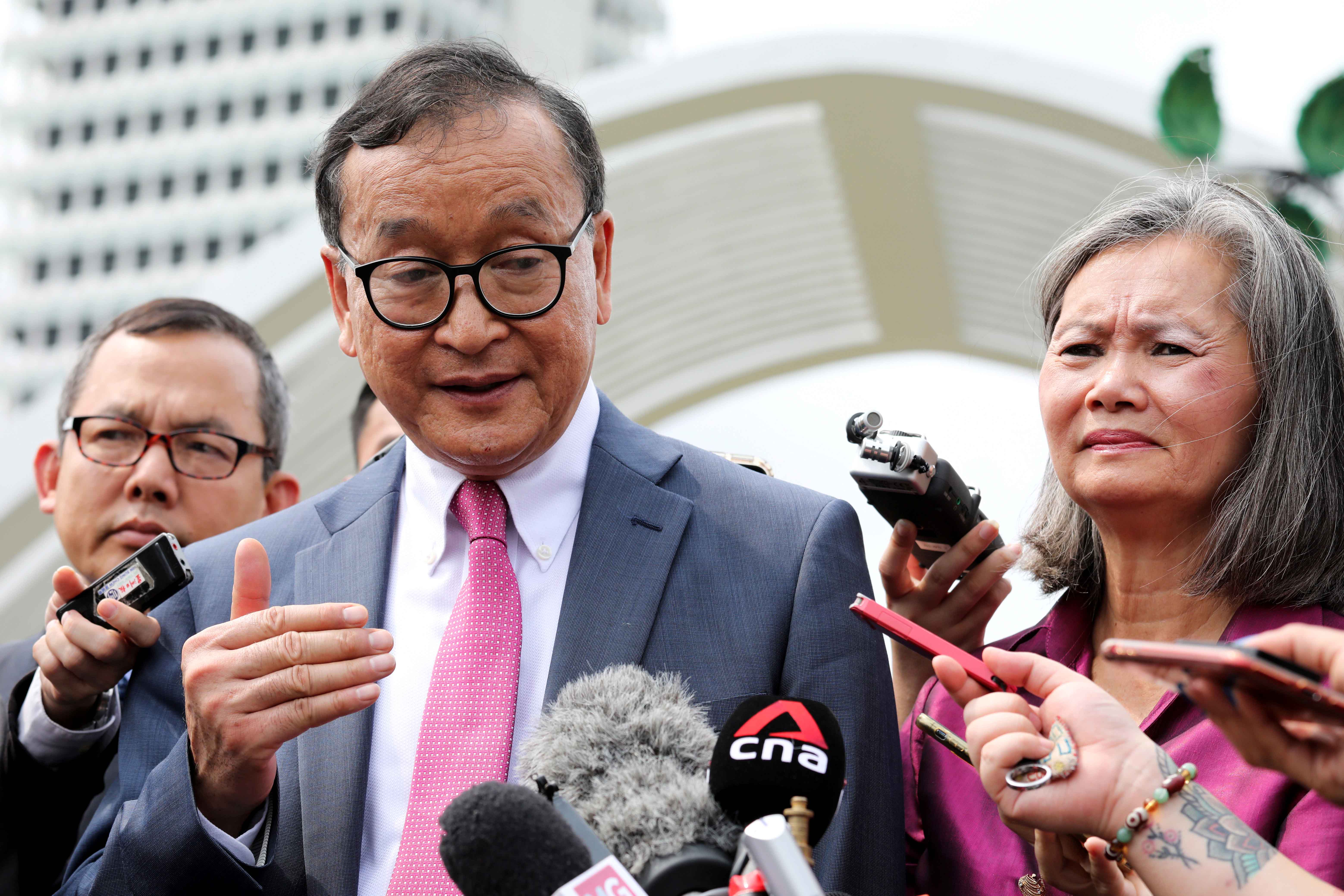 Self-exiled Cambodian opposition party founder Sam Rainsy (L) and Mu Sochua (R), deputy president of the Cambodia National Rescue Party (CNRP), speak to the media in Kuala Lumpur, Malaysia, November 12, 2019.