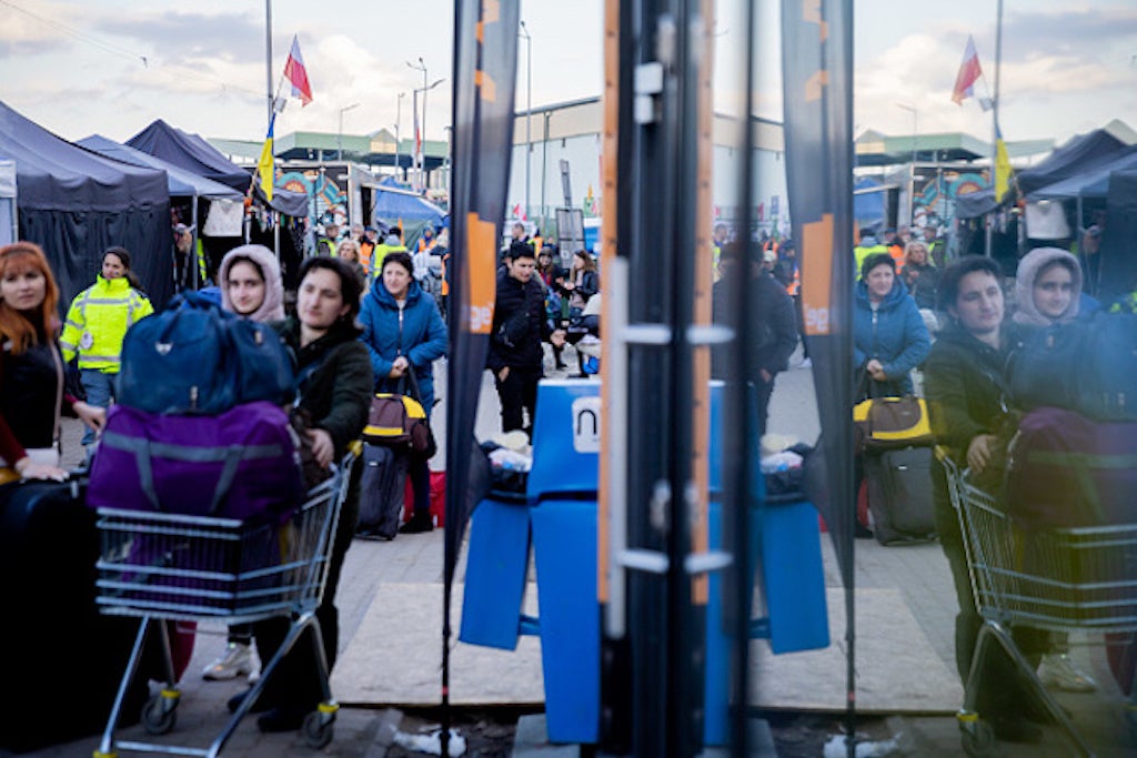 People make their way through Medyka border crossing in Poland, where lack of systematic protection measures expose refugees to risks of trafficking and other exploitation.