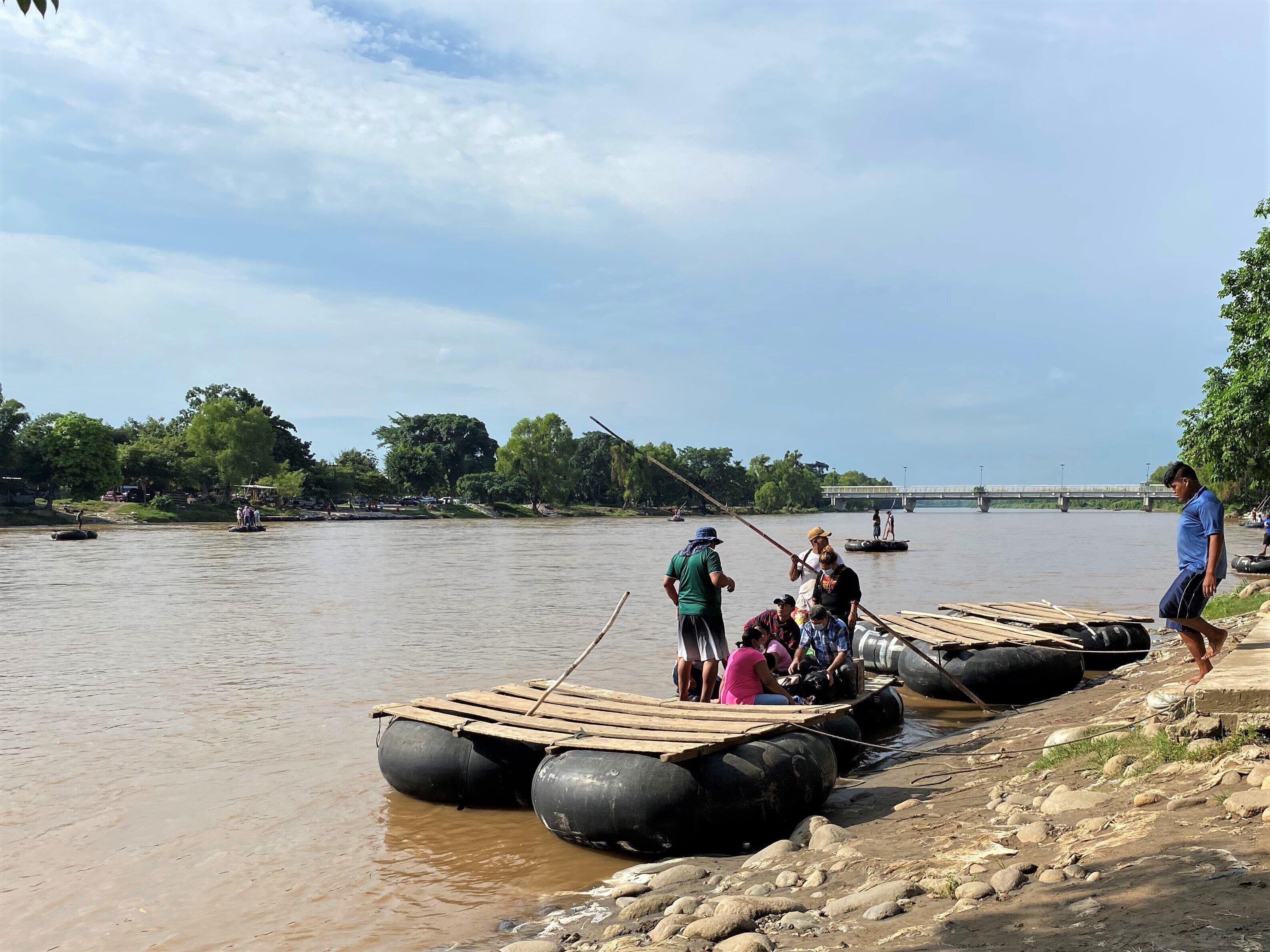 A raftsman prepares to take passengers across the Suchiate river from Ciudad Hidalgo, Mexico to Tecun Uman, Guatemala, August 12, 2021.