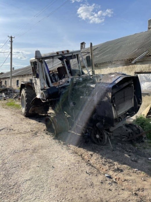 A tractor damaged on May 14, 2022 after hitting a TM-62 series anti-vehicle mine in a field between the villages of Malaya Rohan and Stepanky near Kharkiv, Ukraine. 