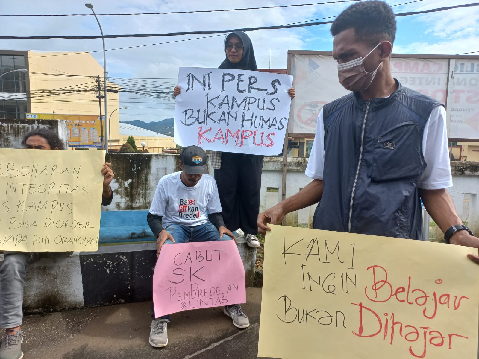 Students protest holding placards