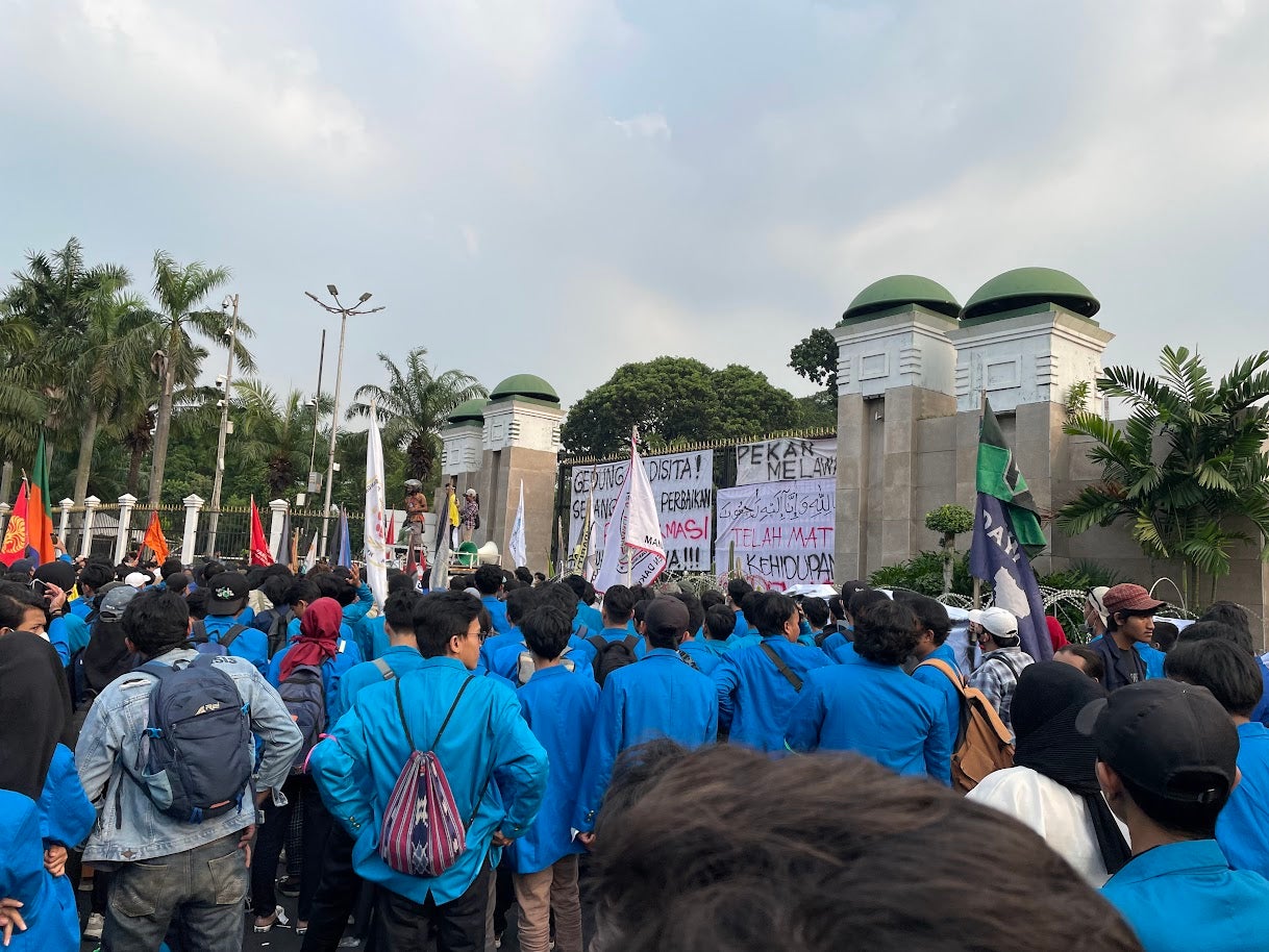 About 2,000 students from several universities in Jakarta protest outside the parliament building, calling on the Indonesian government and parliament to allow sufficient time for public debate on the draft Criminal Code, June 28, 2022.