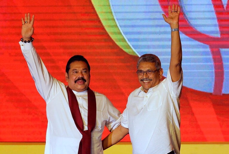 Mahinda Rajapaksa, left, and his brother Gotabaya Rajapaksa waving to supporters in Colombo, Sri Lanka, in 2019.