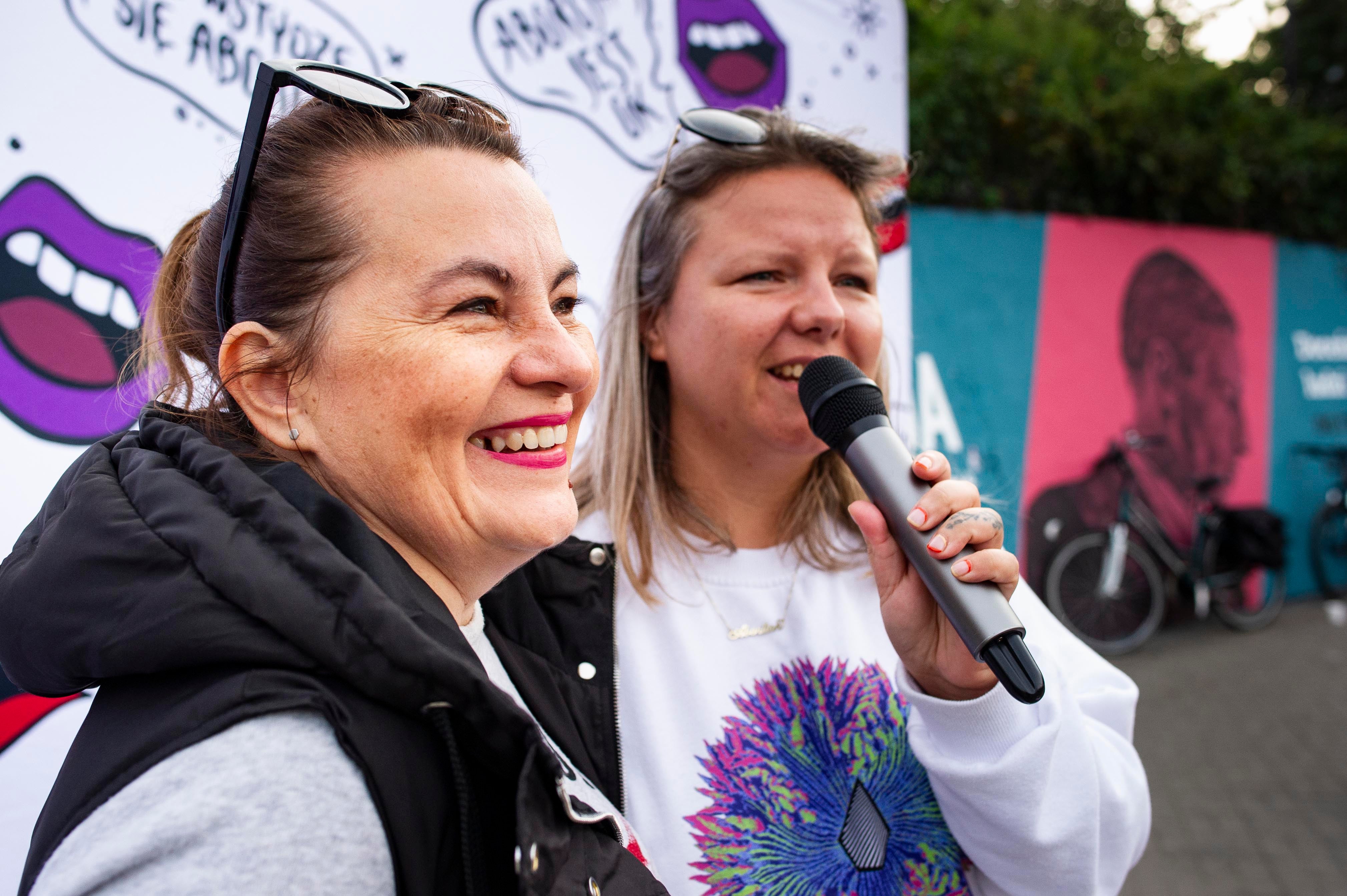 Justyna Wydrzyńska (left) and a colleague from the group Abortion Dream Team address a gathering in Warsaw city center to share the experiences of people who needed abortions, September 28, 2021.