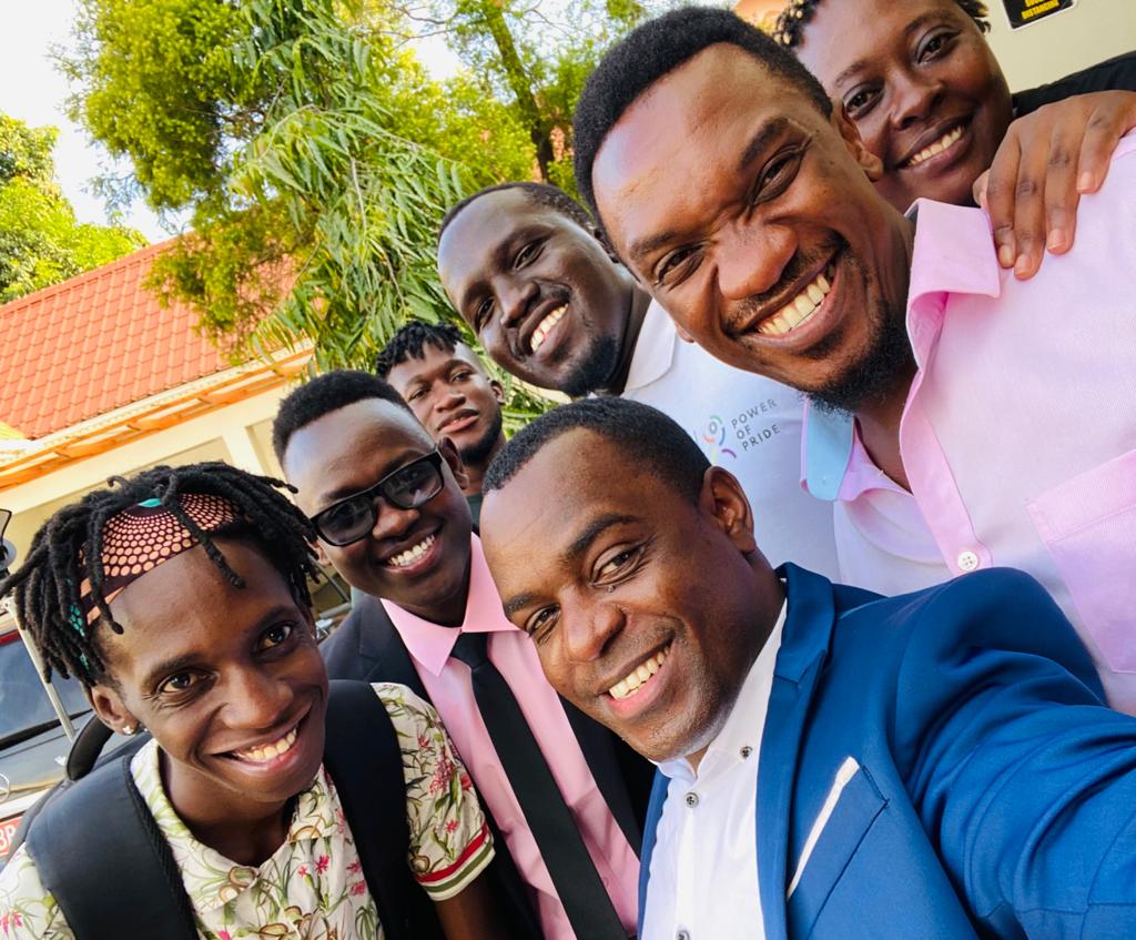 Frank Mugisha, the director of Sexual Minorities Uganda, (center) with members of Uganda's LGBTQ community in Kampala.