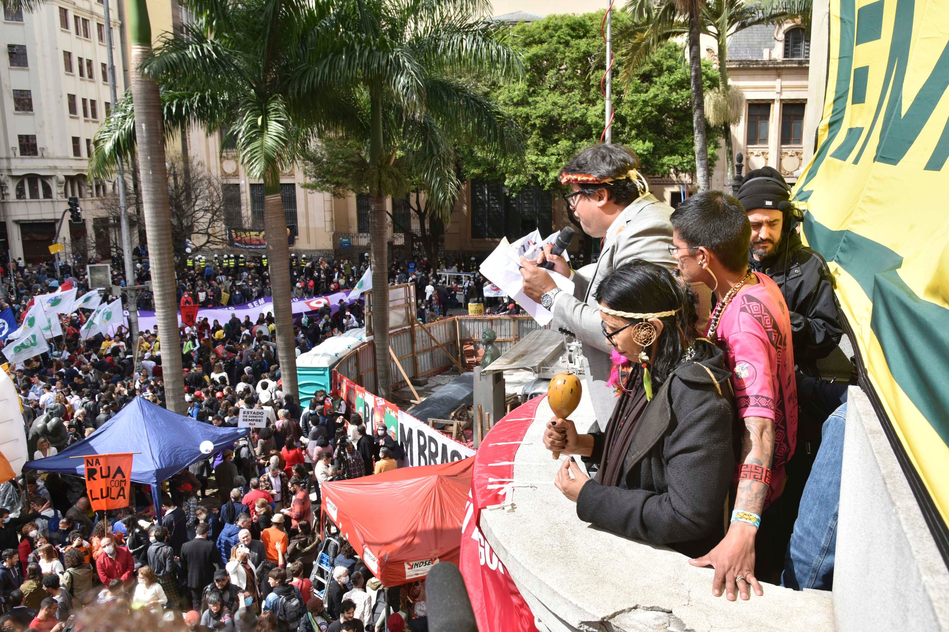 Indigenous leaders read a manifesto to a large crowd at a law school