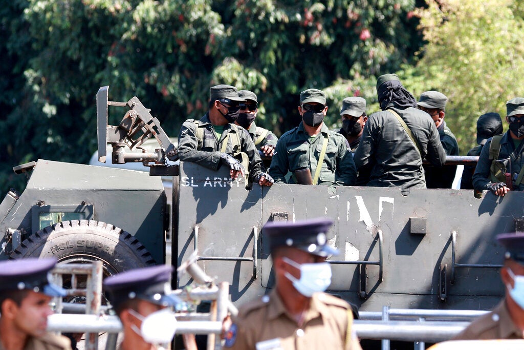Sri Lankan police and military personnel near the parliament in Colombo, July 19, 2022.