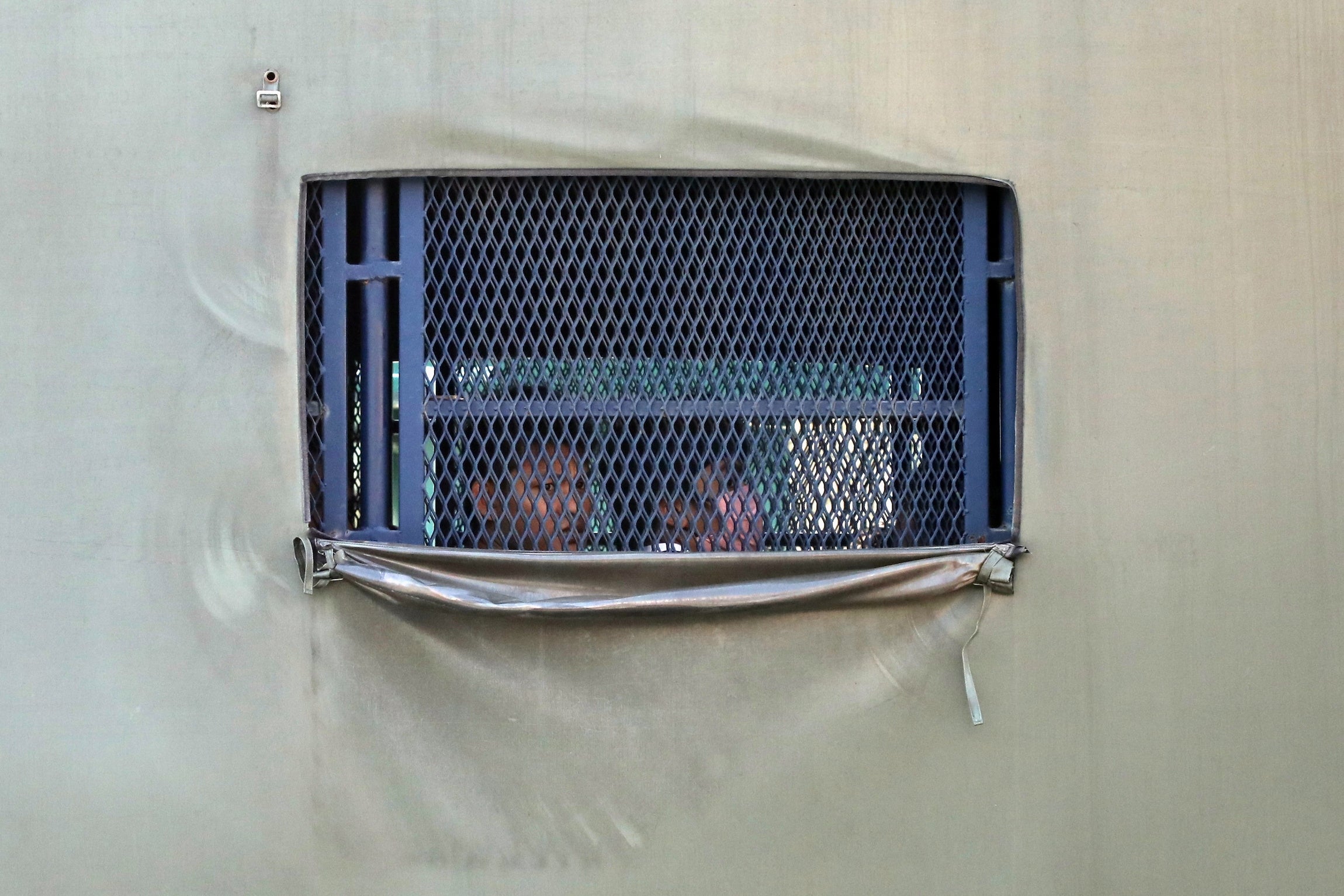 Immigration authorities transport Myanmar nationals before their deportation from Malaysia.