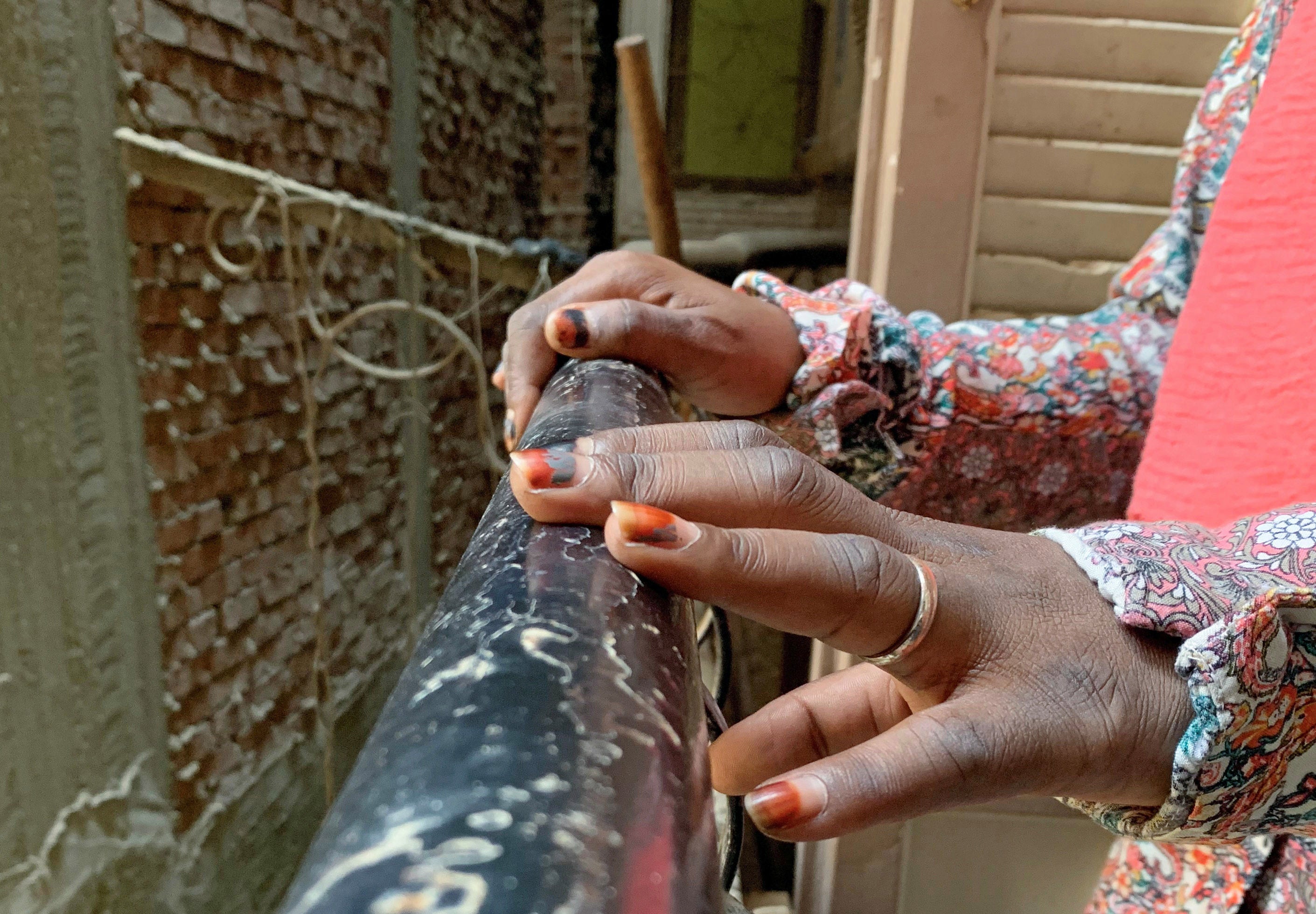 The hands of a refugee survivor of sexual assault, Cairo, Egypt.