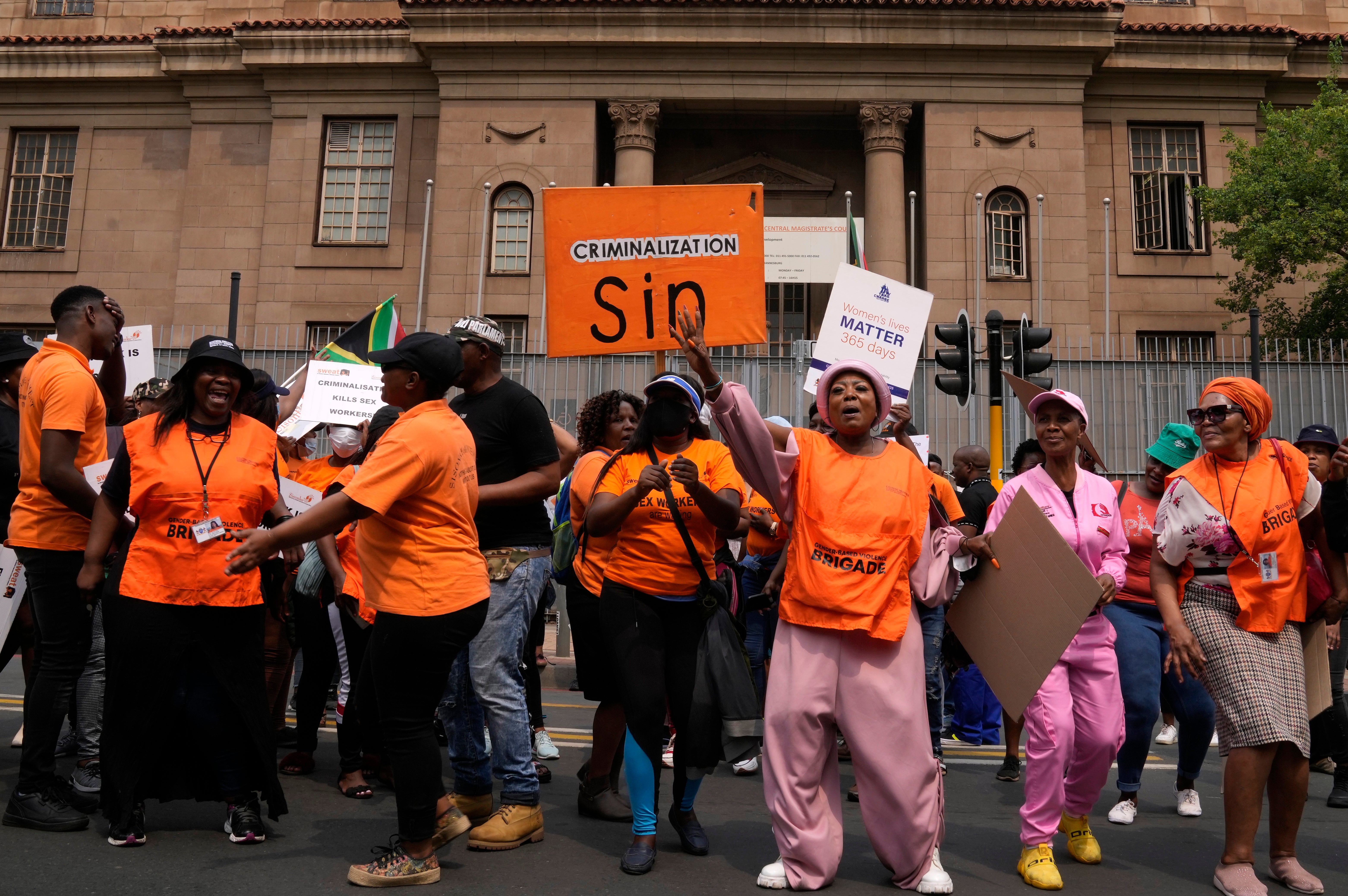 South African women's rights groups and sex workers demonstrate outside the magistrate court in Johannesburg