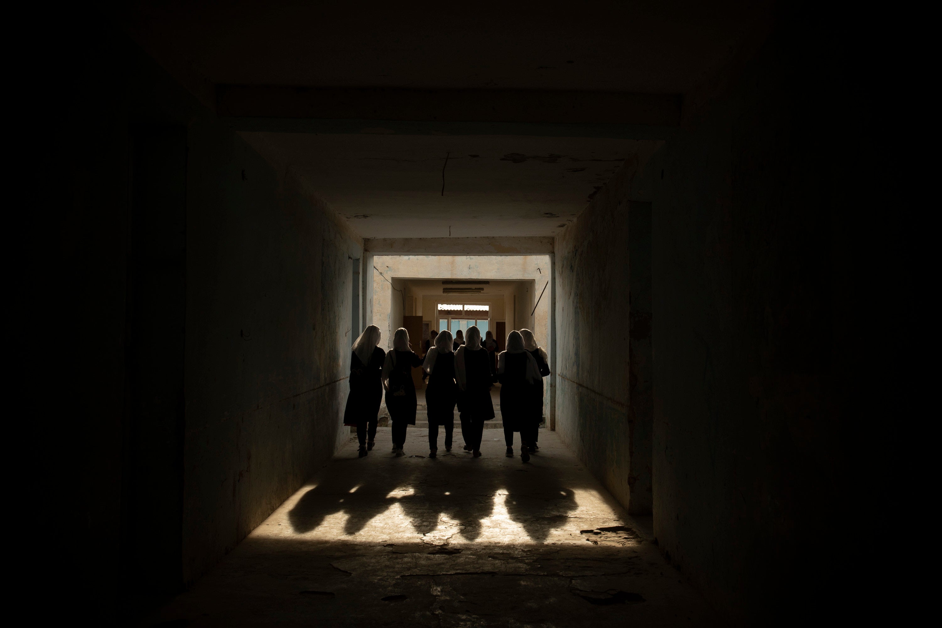Female high school students in a hallway