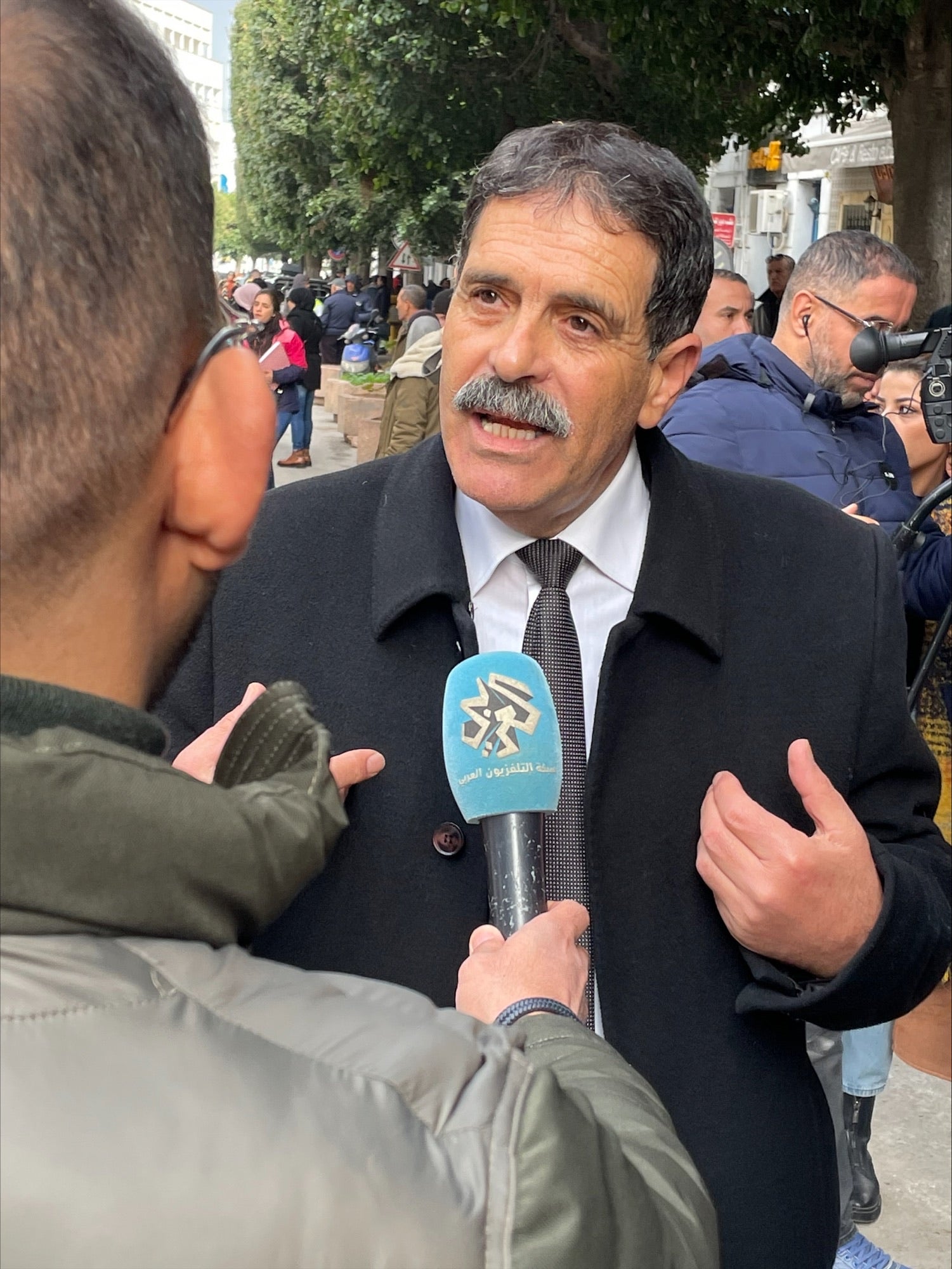 Lawyer Ayachi Hammami before his court hearing for speech offenses in Tunis.