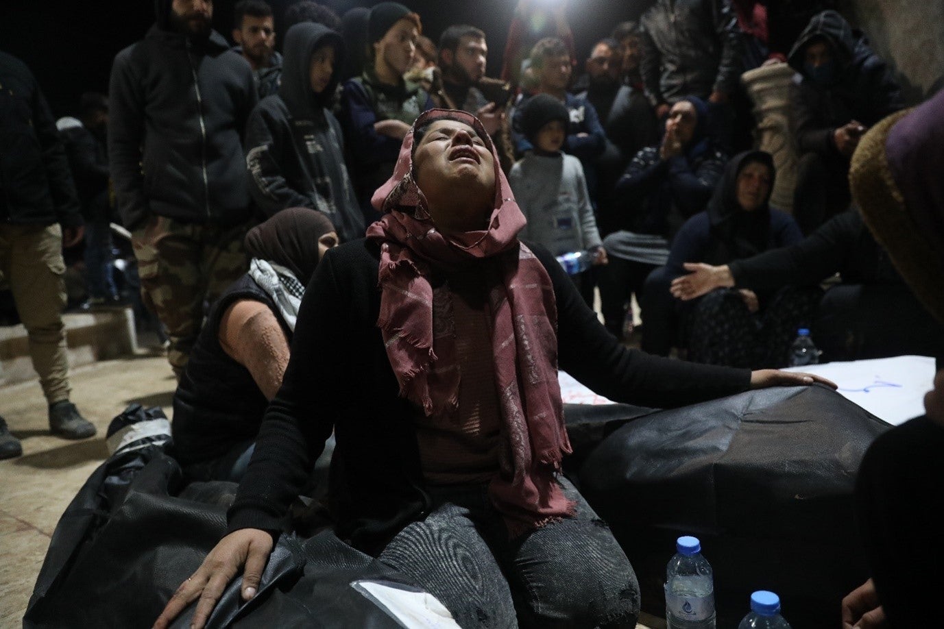 Relatives of the victims and the people of Jinderis gather in Atma city near the Syrian border with Turkey during funeral proceedings for the victims who died at the hands of Turkish-backed fighters during Newroz celebrations. 