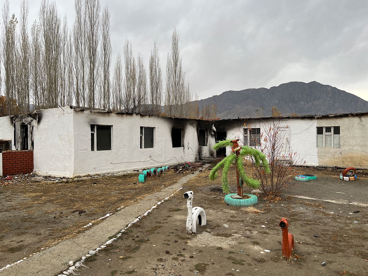 A burnt-out kindergarten in the Kyrgyz village of Ak-Sai. The village saw widespread looting and destruction while briefly under the control of Tajik forces on September 16, 2022.
