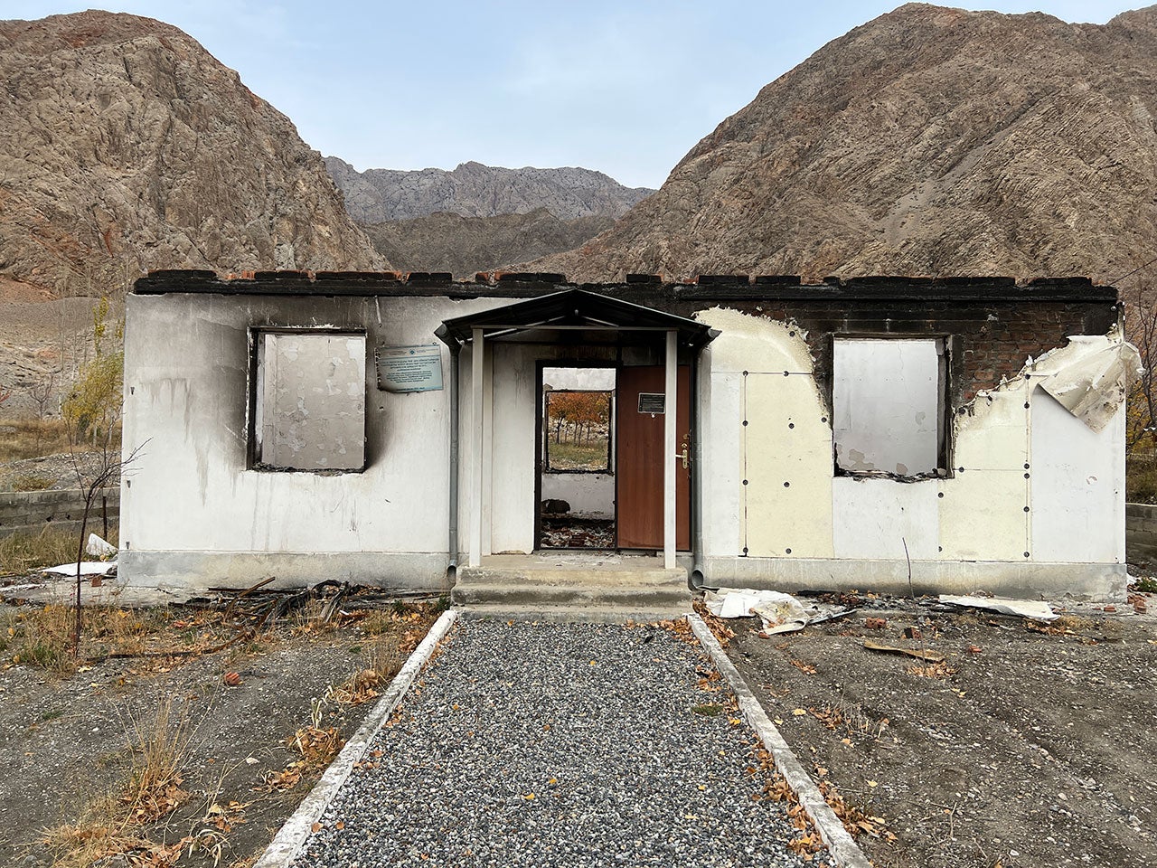 This burnt-out primary medical facility in the Kyrgyz village of Kapchygai shows no signs of damage from fighting nor evidence that fire spread naturally to the building.