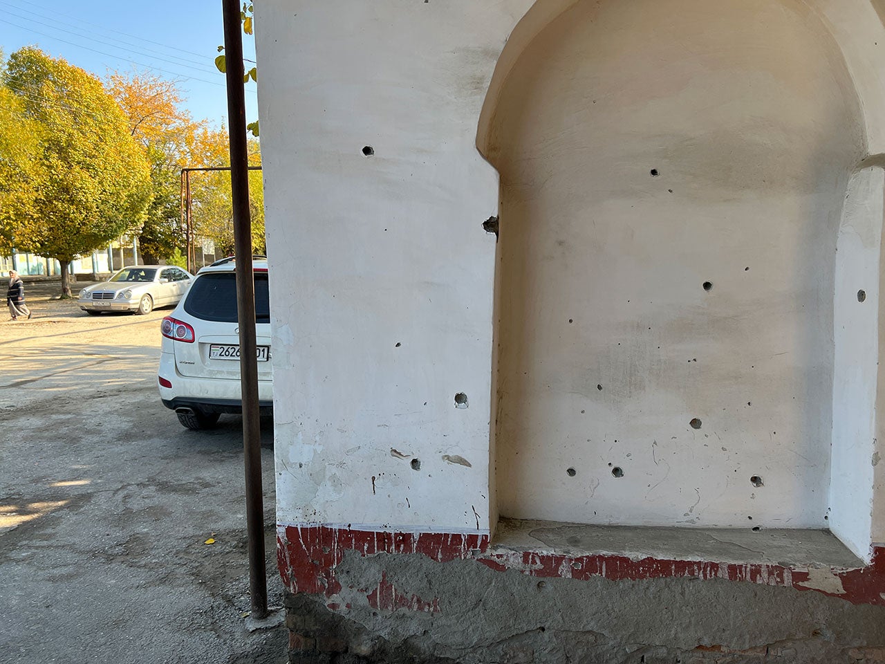 Munition impacts and blood stains on the external walls of a mosque in Ovchi Kal’acha (Tajikistan) after a Kyrgyz drone strike on September 16, 2022, killed ten civilian men and injured around a dozen others.