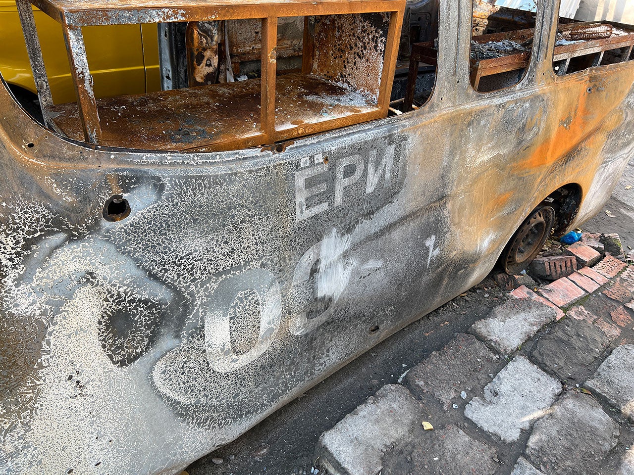 Markings stating “Ambulance” on the wreckage of a Tajik ambulance from Chorkuh Village Hospital, which was attacked near a bridge by the border in Chorbog on September 16, 2022, along with another ambulance and a car carrying civilians.