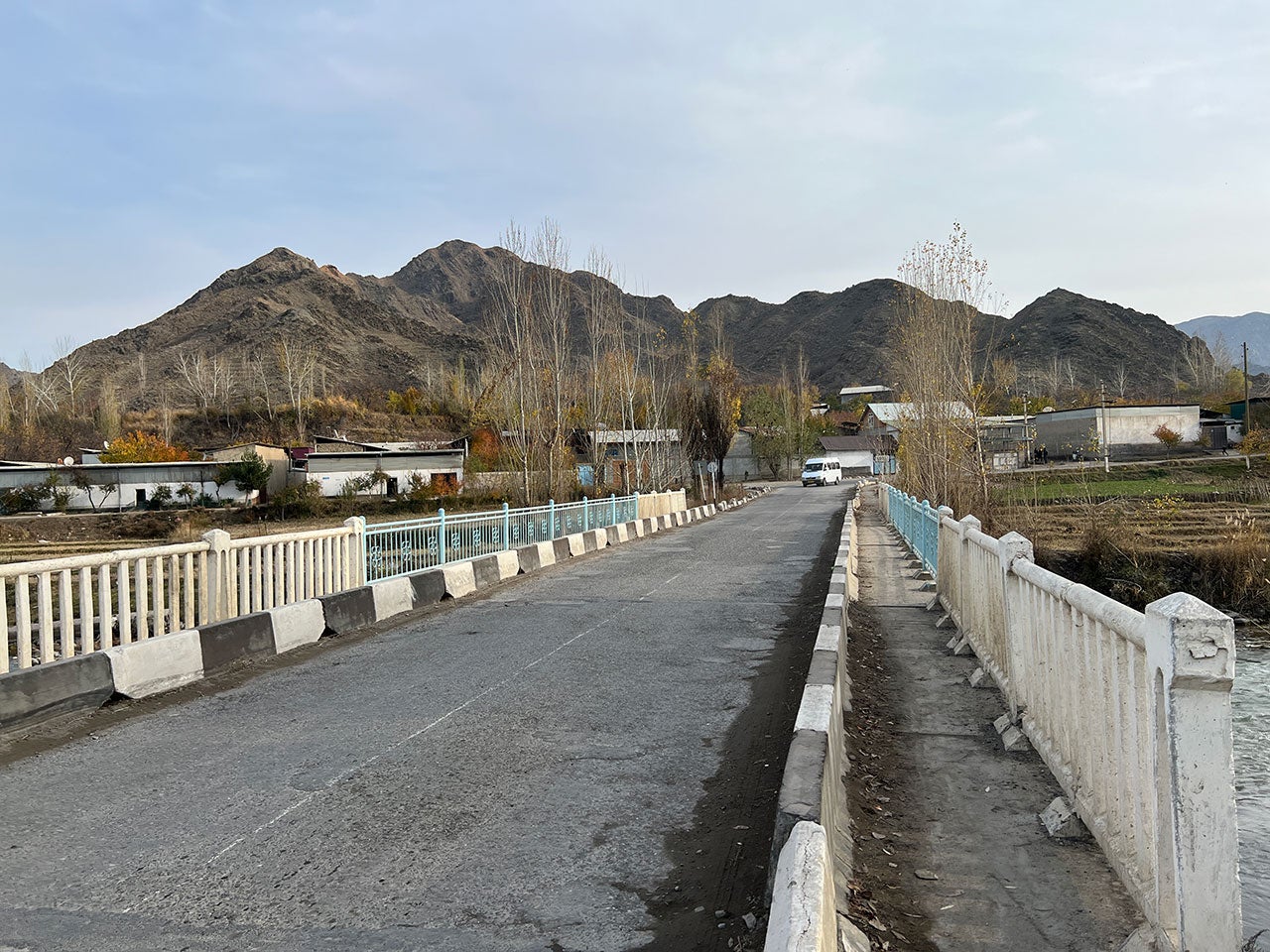 The bridge linking the Tajik villages of Chordeh and Chorbog on the border near the Kyrgyz village of Dostuk (Batken district), where two Tajik ambulances and a car with civilians came under attack on September 16, 2022. Burnt-down trees at the end of the bridge marks the location where one of the ambulances was attacked.