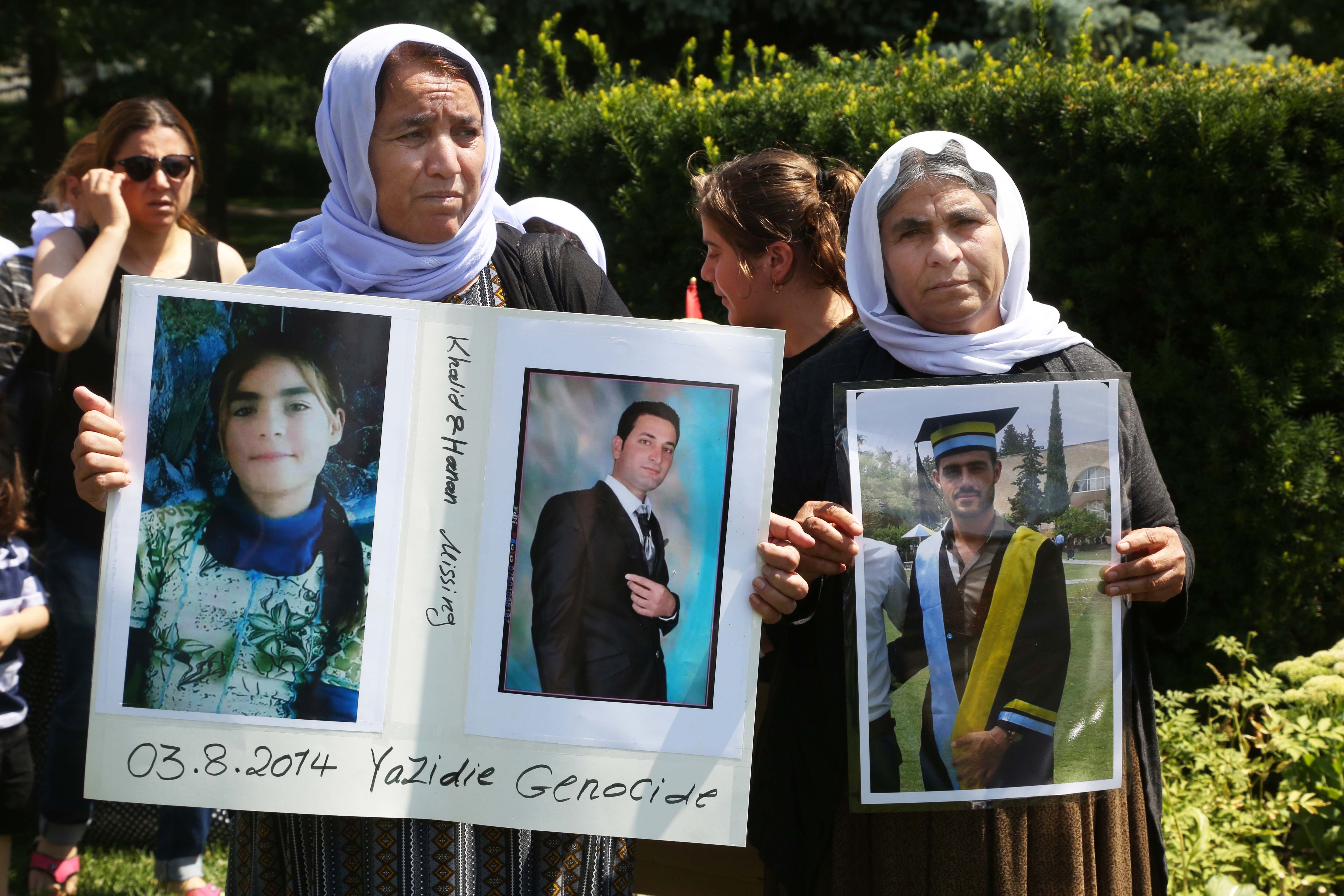 Members of the Yazidi community from Iraq who escaped persecution by ISIS hold a rally outside Queen's Park in Toronto, Canada, August 4, 2019.