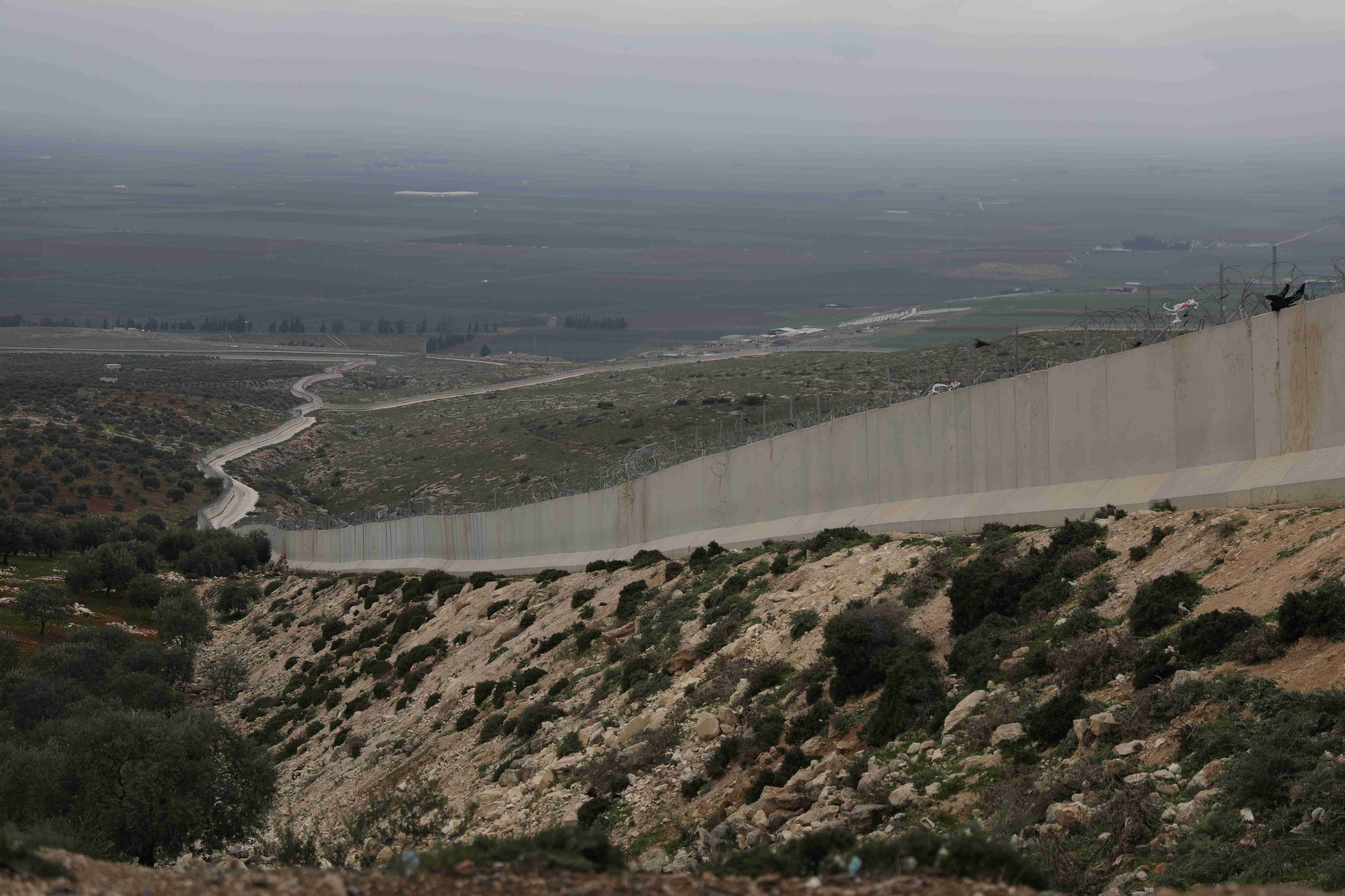 A picture of the cement wall separating Syria and Turkey near Haram in Northwest Syria on March 14, 2023.