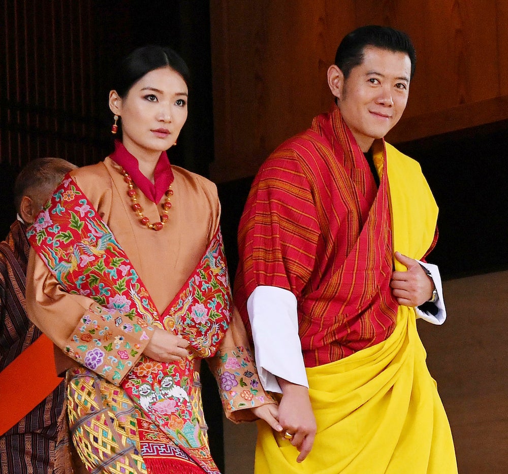 The king of Bhutan, Jigme Khesar Namgyel Wangchuck, and his wife attend the enthronement ceremony at the Imperial Palace in Tokyo.