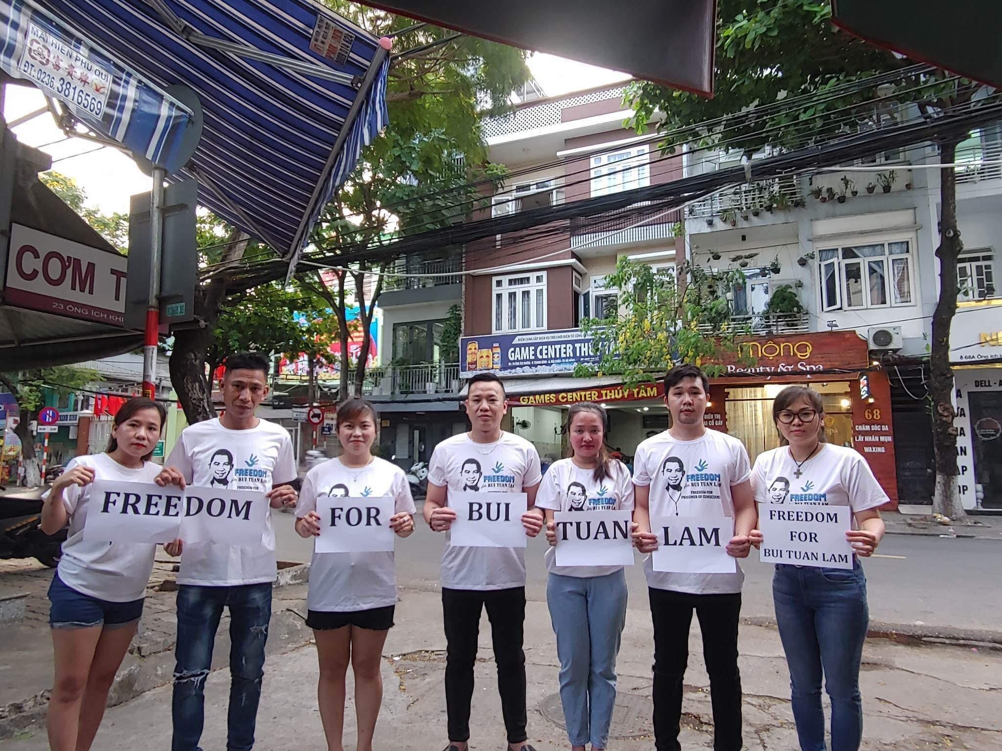 The wife, two brothers, and friends of Bui Tuan Lam gather in Da Nang city, Vietnam, to demand his freedom, May 2023.