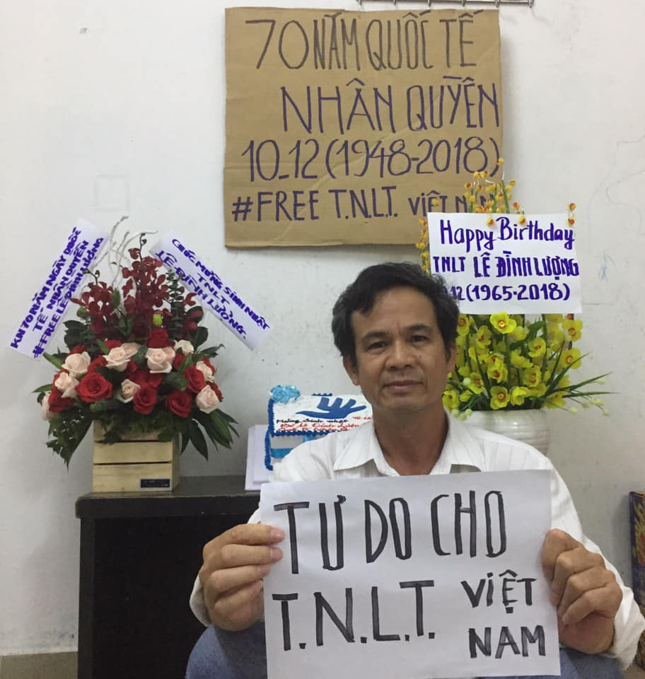 Tran Van Bang holds a sign that says “Freedom for Vietnamese Prisoners of Conscience” to celebrate the 70th anniversary of the Universal Declaration of Human Rights.