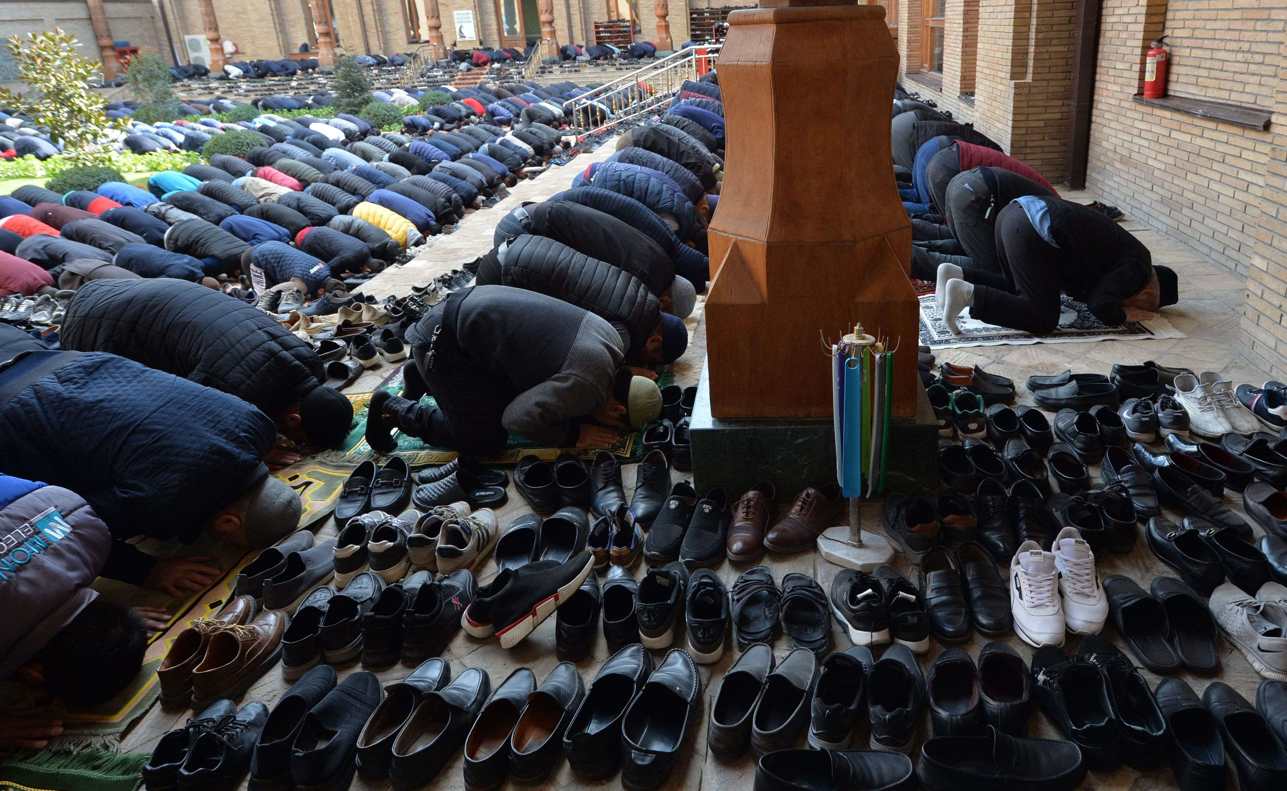 Muslim worshippers pray during Friday prayers at the Khazrati Imam Mosque in Tashkent, Uzbekistan, October 22, 2021. 