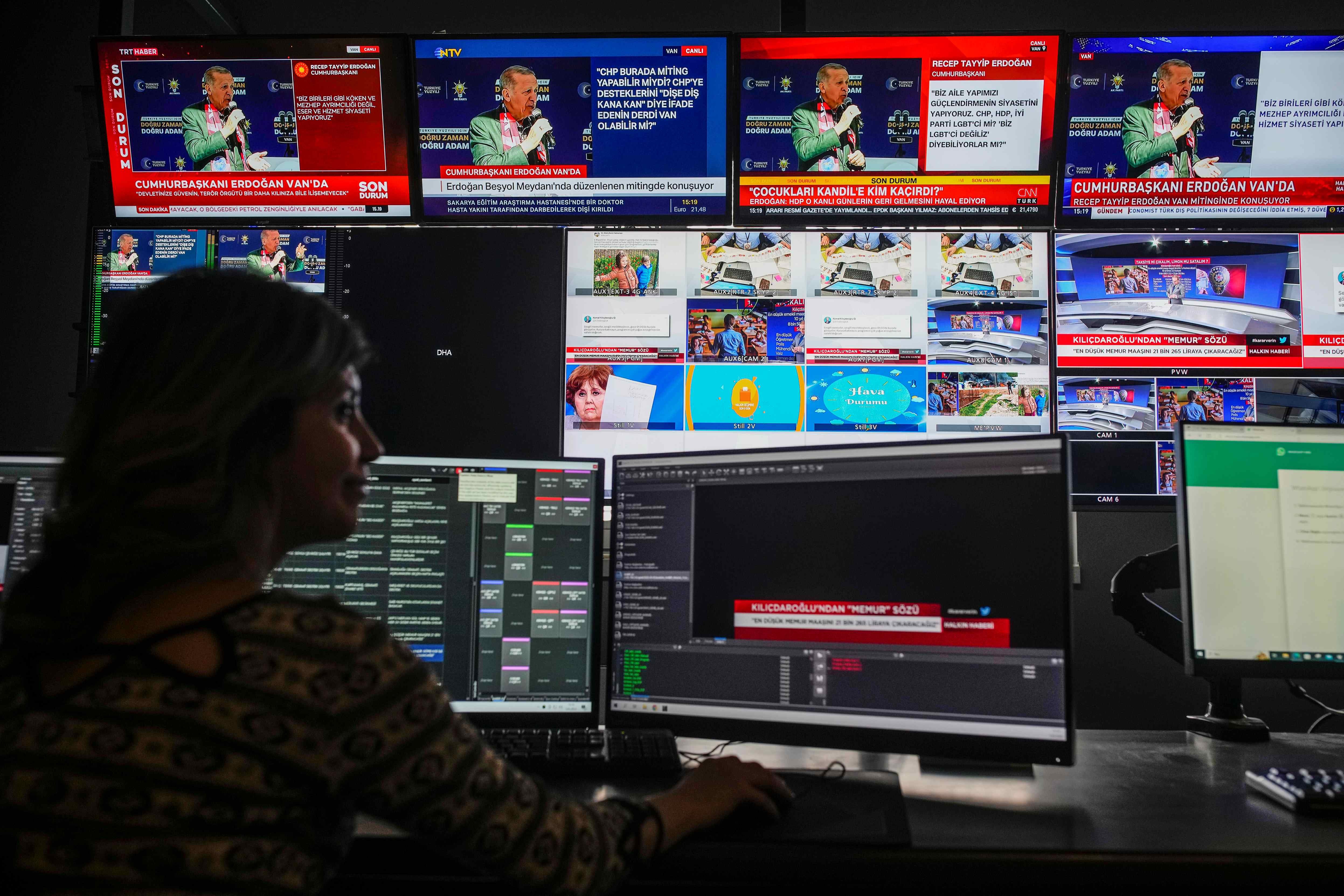Screens from simultaneous broadcasts by different news channels display Turkish President Recep Tayyip Erdoğan, top, speaking during a rally in the eastern city of Van, on May 5, 2023. Photo taken at Halk TV headquarters.