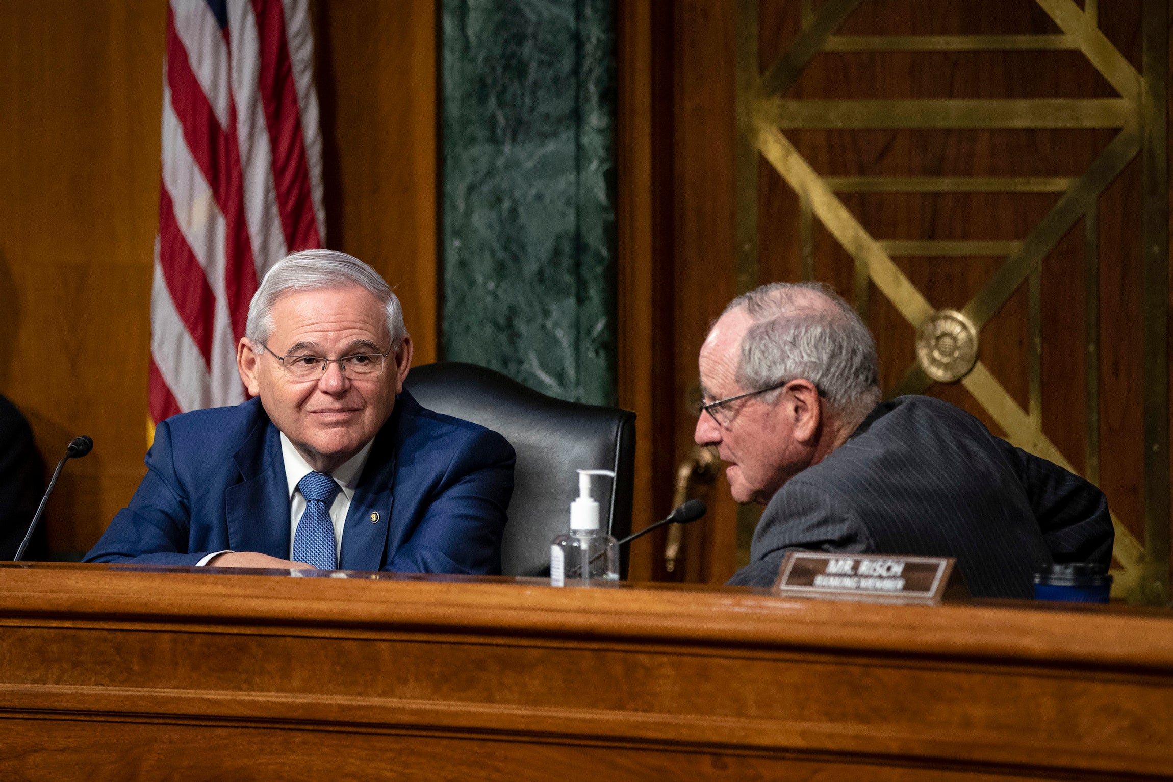 Sen. Robert Menendez of New Jersey, the chairman of the Senate Foreign Relations Committee (left), speaks with Sen. Jim Risch of Idaho, during a Senate Foreign Relations committee hearing.