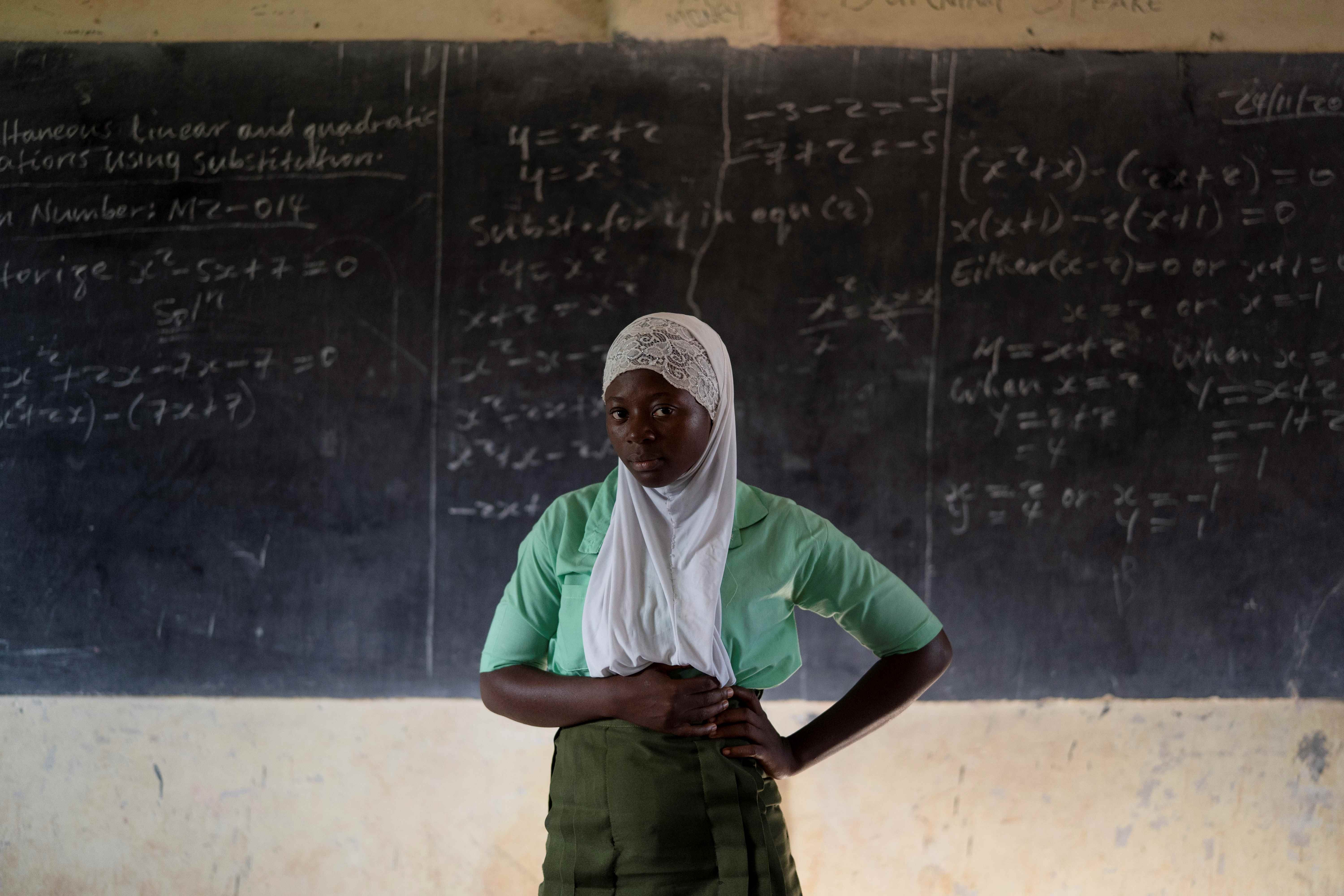 A student poses for a portrait in the classroom of her school in Koidu, Kono district, Sierra Leone, on November 24, 2020. 