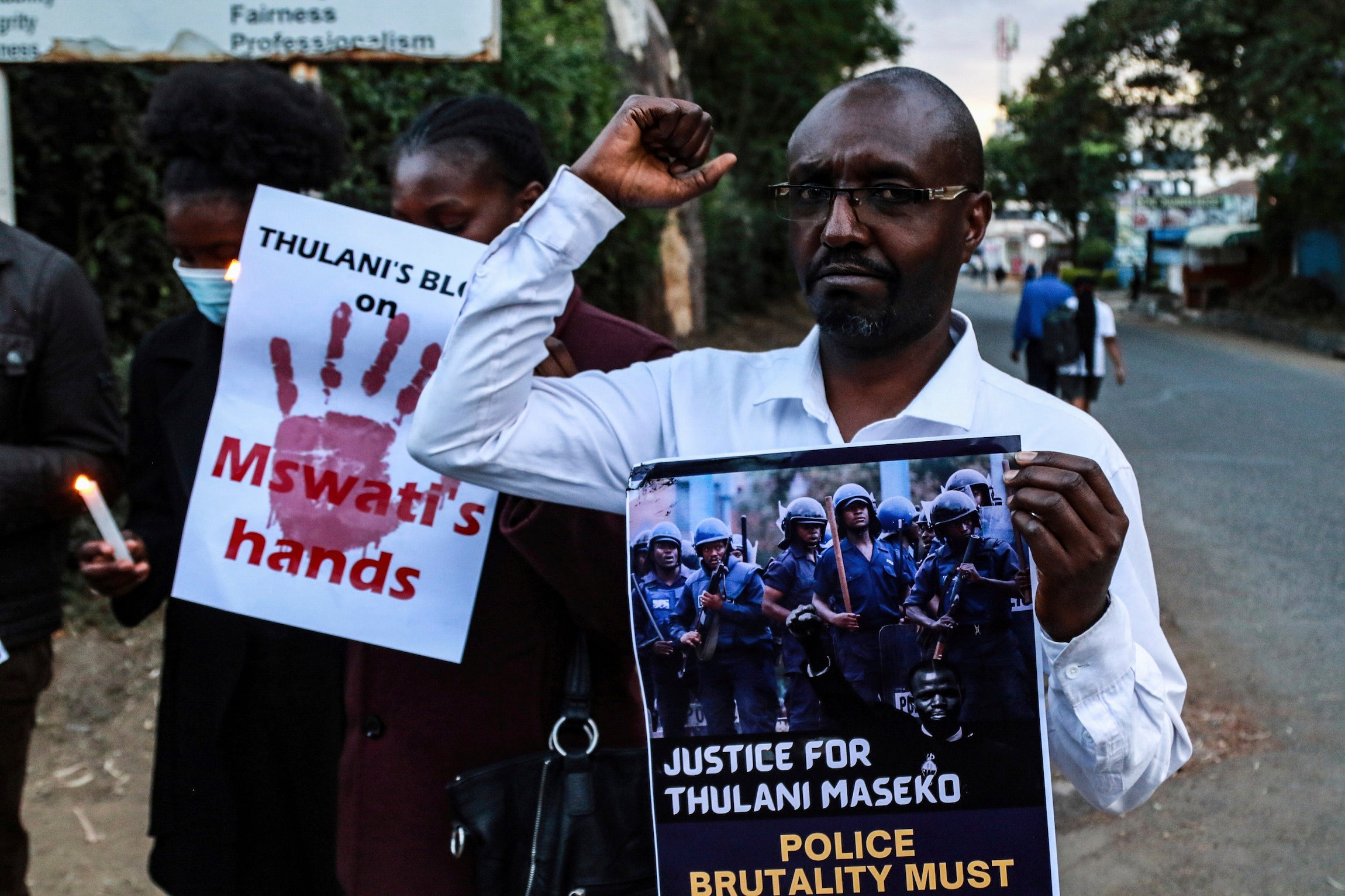 Activists hold posters and chant to pay tribute to the assassinated Eswatini, formerly Swaziland, Human Rights Lawyer Thulani Maseko in Nakuru Town, January 30, 2023. 