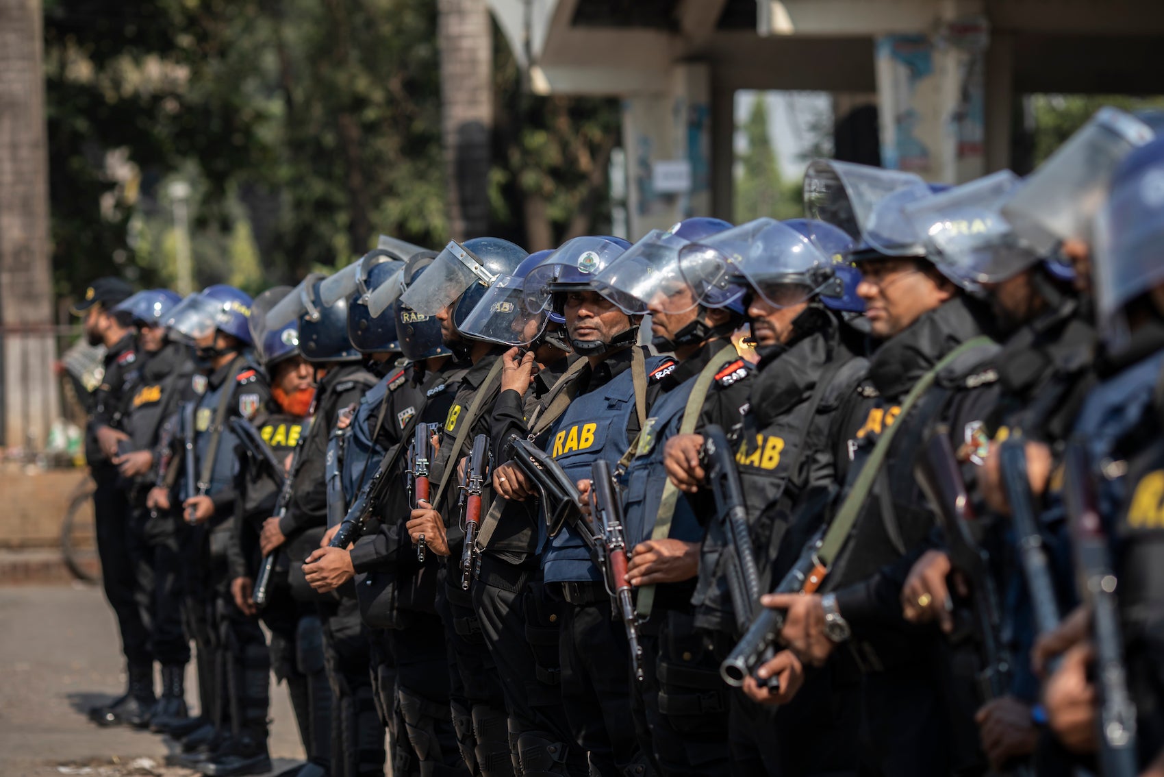 Bangladesh's Rapid Action Battalion soldiers stand on guard during the demonstration in Dhaka, December 10, 2022.