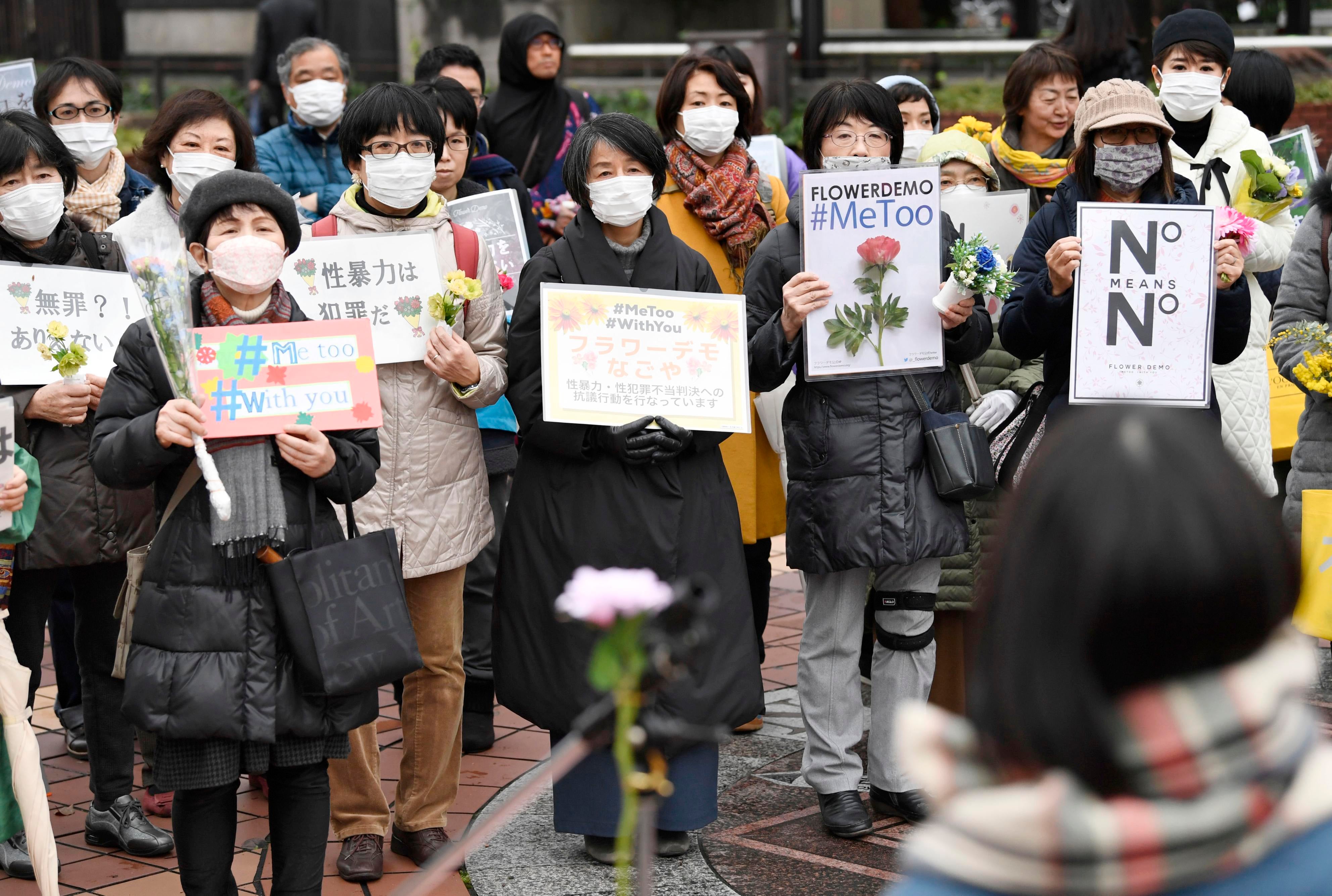 Protesters attend a gathering of the Flower Demo movement against sexual violence in Nagoya, Japan, March 8, 2020.