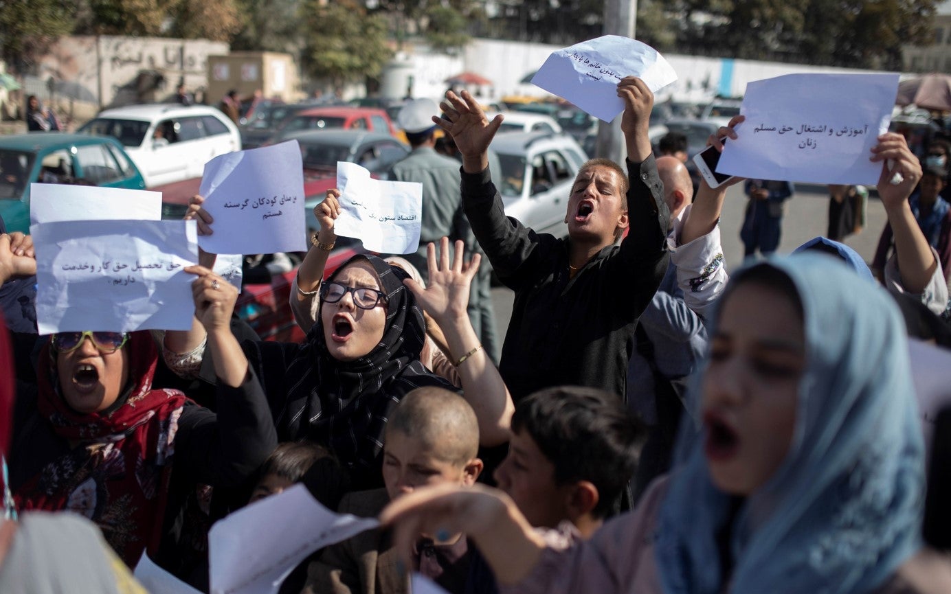Afghan women chant during a protest in Kabul, Afghanistan, October 21, 2021.