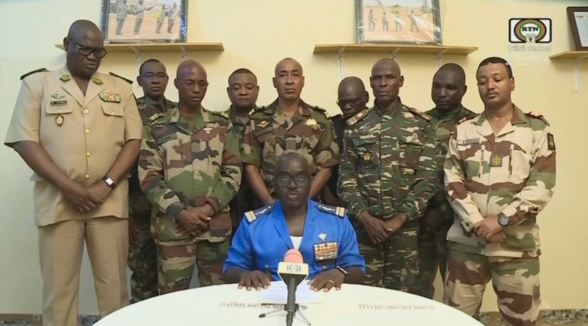 Col. Maj. Amadou Abdramane, front center, with a delegation of military officers, appear on Niger State TV to announce their coup on July 26, 2023, in Niamey, Niger. 